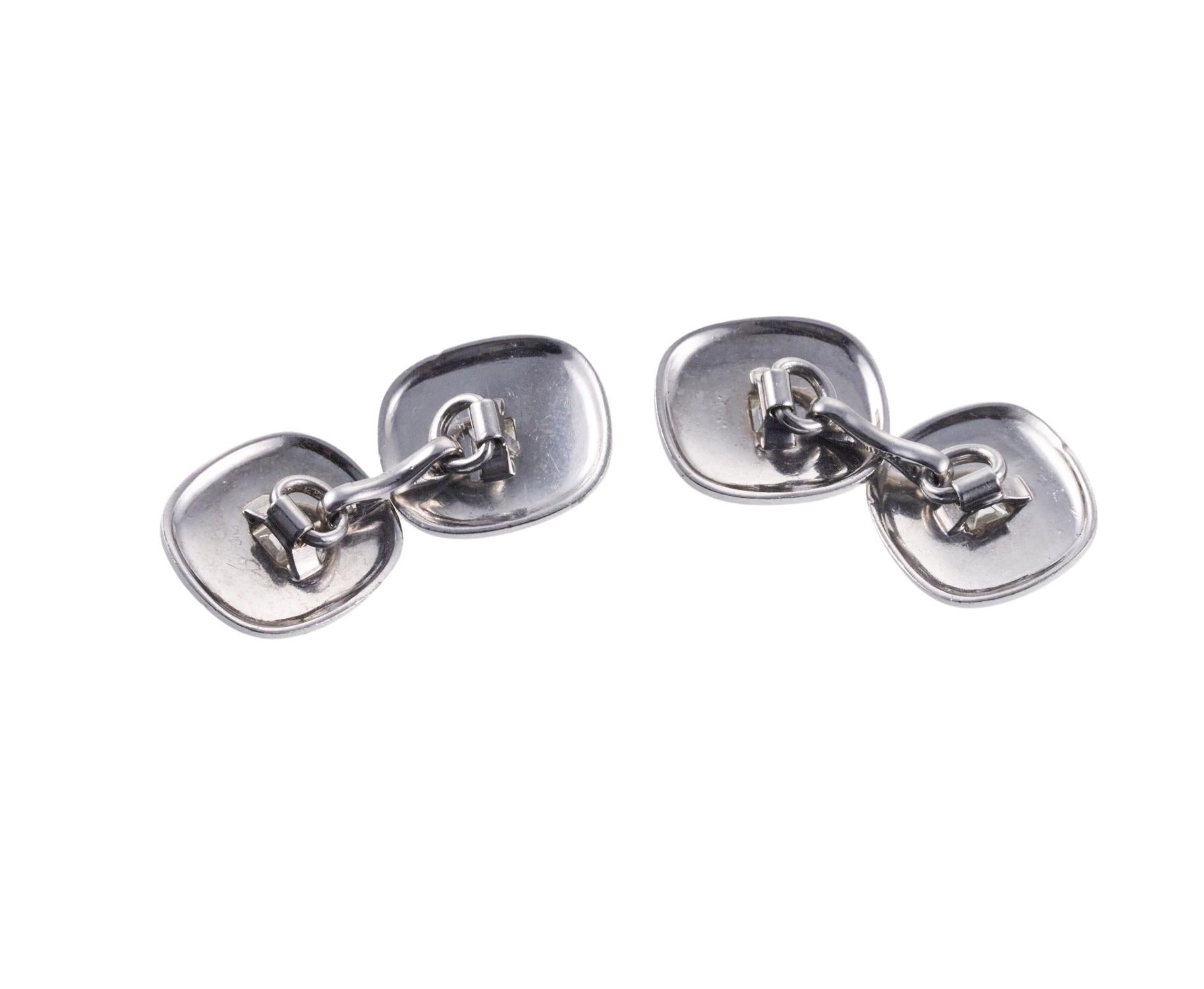 Pair of classic Midcentury platinum cufflinks, each top set with an approx.  0.08ct diamond (total 0.32ctw GH-VS). Each cufflink top measures 14.5 x 12.8mm. Hallmarked 