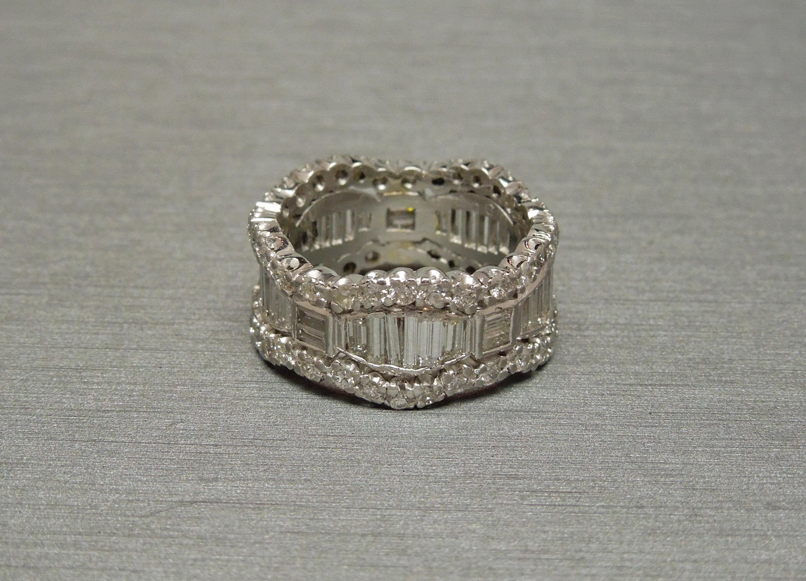 This Midcentury Triple Row Diamond Eternity Band was constructed in a Tiara-inspired pattern - The Crown being a symbol of Loyalty and Love in addition to the eternity design, symbolizing eternal Love.
Containing a central row of Graduating