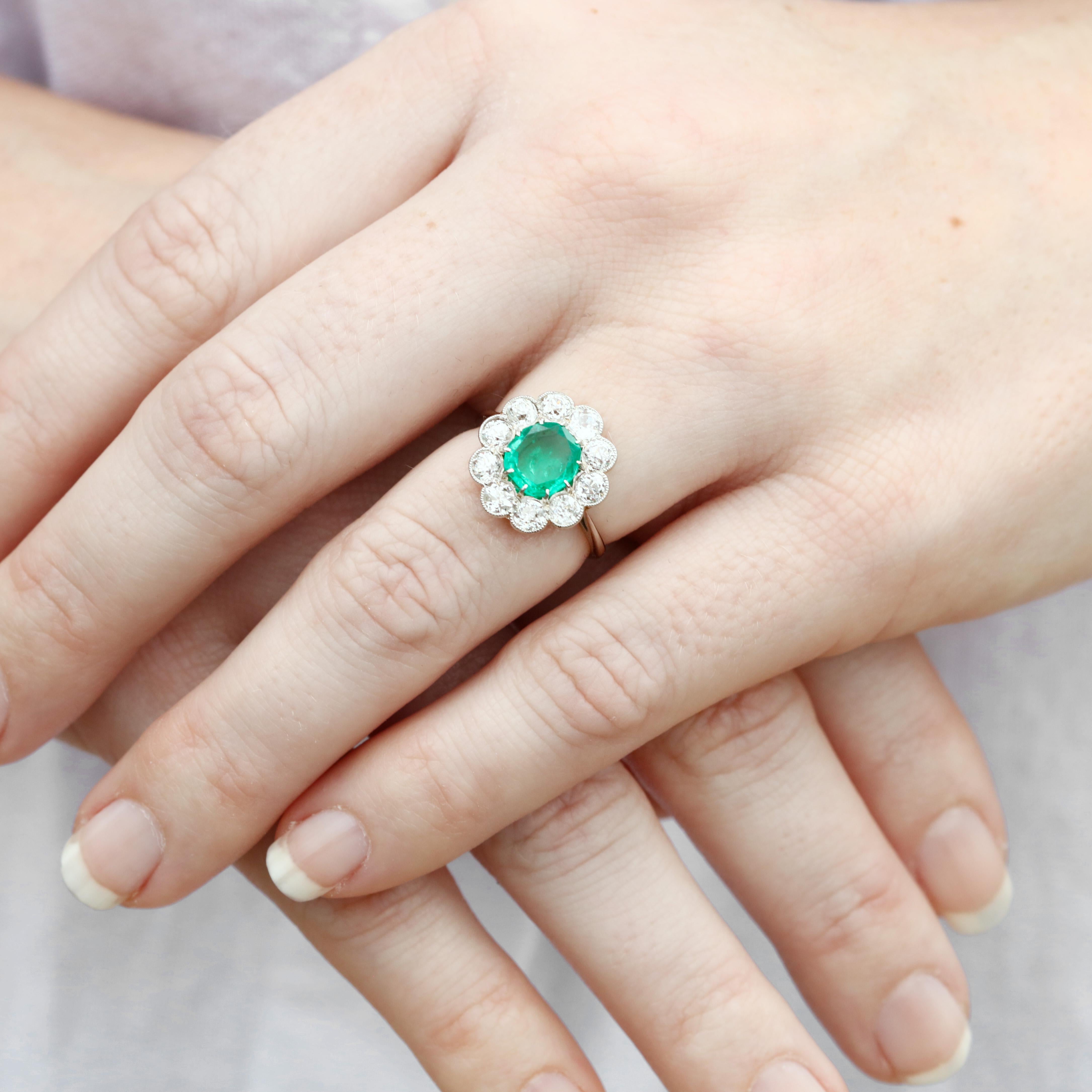 Midcentury Platinum, Emerald and Diamond Halo Ring In Good Condition In McLeansville, NC