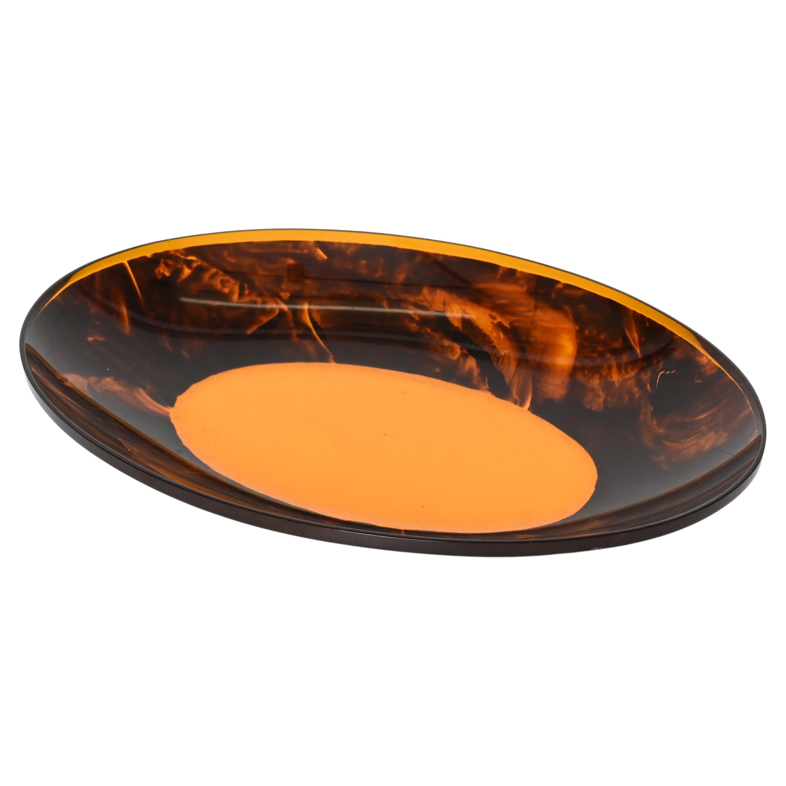 Amazing mid-century plexiglass with tortoiseshell effect oval centrepiece. This fantastic piece was designed in Italy during the 1970s in the style of Christian Dior.

This item is unique as it has a fantastic as there is magnificent because of