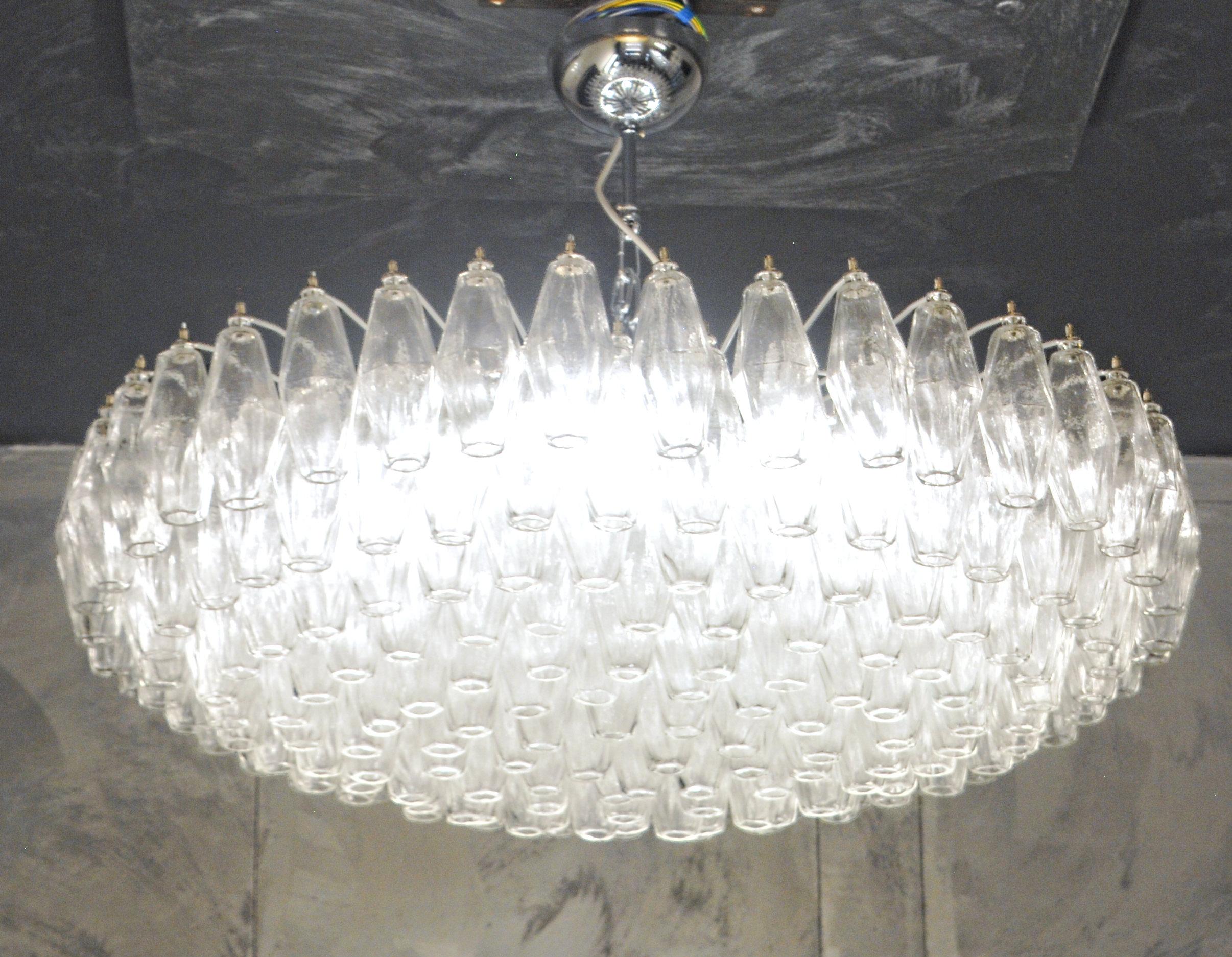 Sumptuous exemplary midcentury chandelier. For large a large hall, ballroom or public spaces. Would be stunning in a large midcentury living room or an eclectic home. This triedri chandelier is only in clear crystal glass, the two color combination