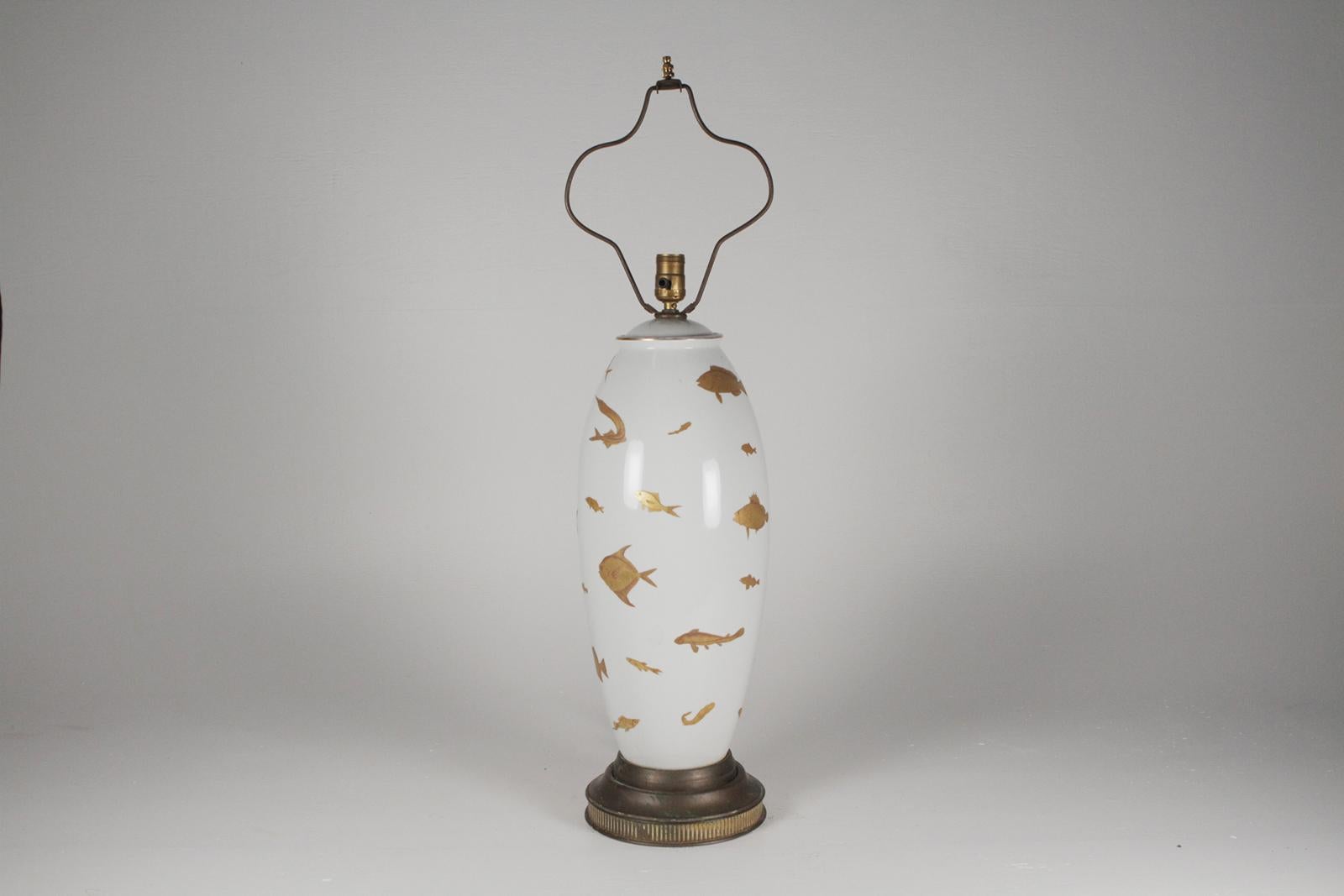 Midcentury porcelain hand-painted table lamp with gilt painted fish.
Dimensions: 25.5” H to socket x 9” diameter, height with harp 33.5”.
Custom made shade for the lamp