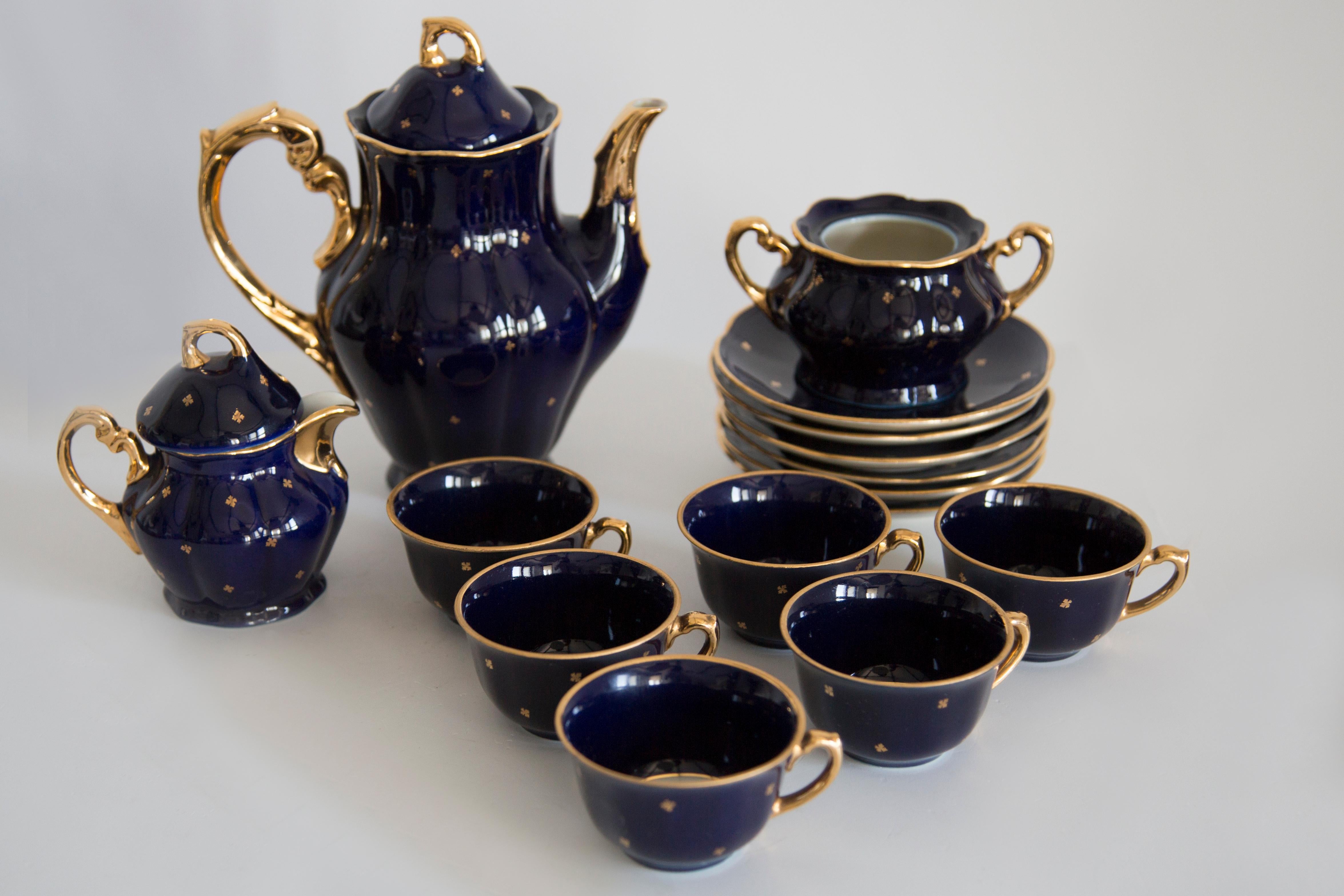Lovely Mid-Century Modern porcelain painted marble coffee set. 

Service for 6 people produced by Zaklady Porcelany in Wloclawek in the 1960s.

The service consists of a jug, sugar bowl, creamer, 6 cups and 6 saucers. 
One missing on sugar bowl -