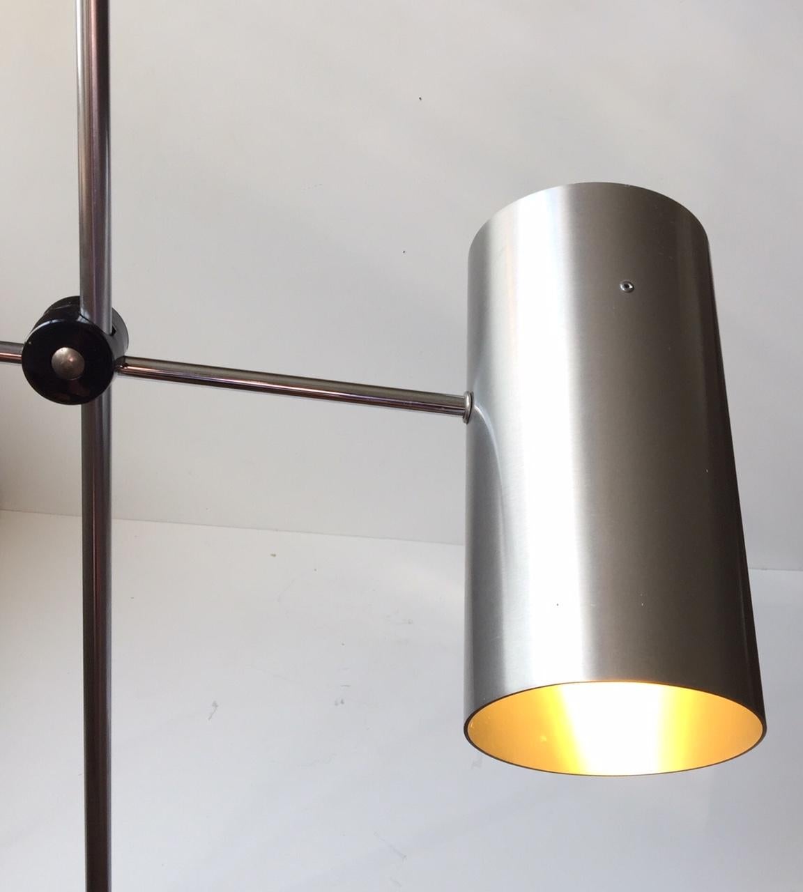 A 'President' floor lamp manufactured by Fog & Mørup in Denmark during the 1960s. It was originally designed by Jo/Johannes Hammerborg in 1966. But this configuration remains slightly different due to the Pipe/cylindrical shade in Brushed aluminium.