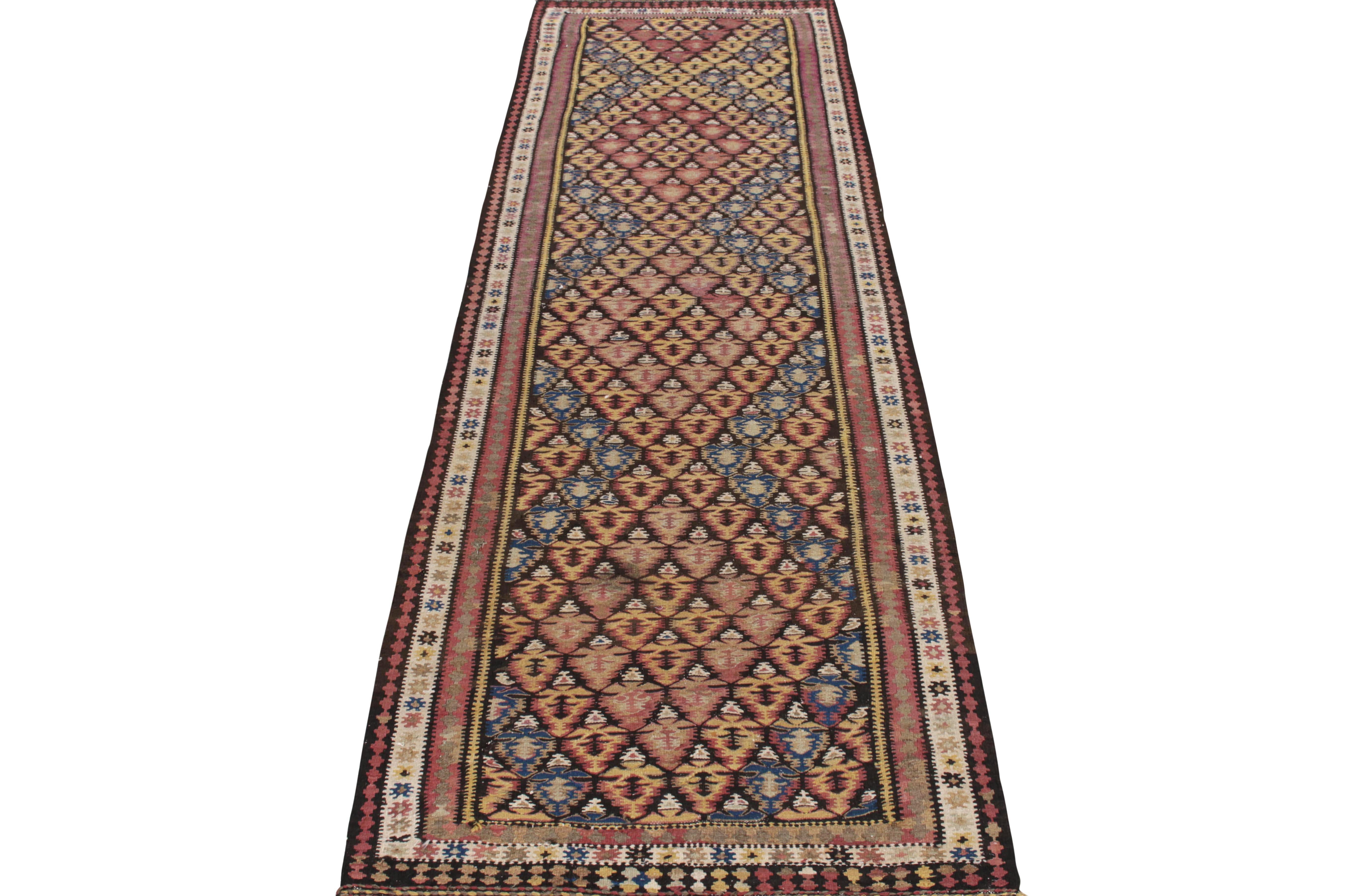 Handwoven circa 1950-1960, this 4x12 vintage Persian kilim runner showcases an ambitious vision in design where geometry is applied skillfully for a series of well defined diamond medallions in the centre, deliciously distinguished by patterns