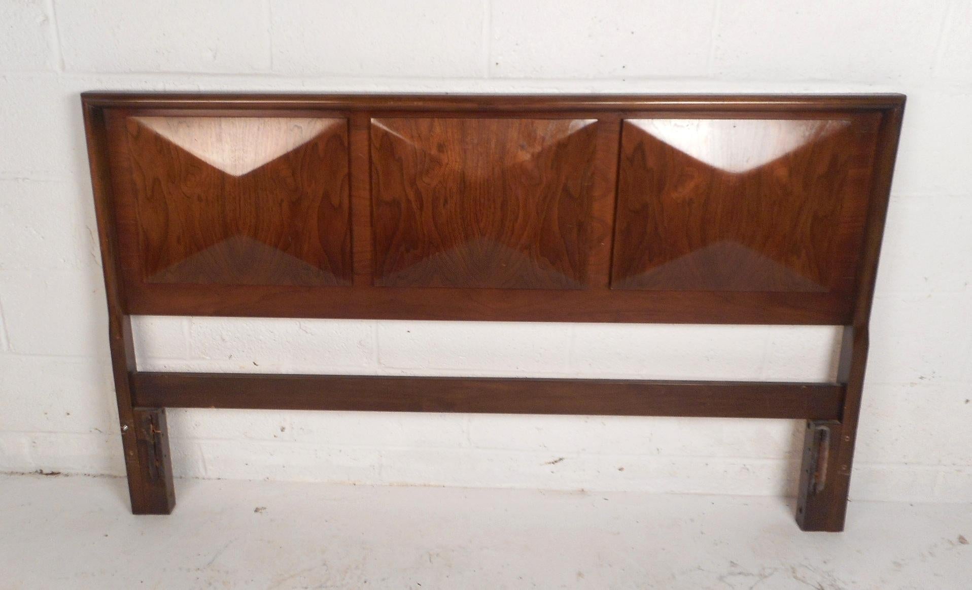 This beautiful vintage modern headboard features a three dimensional diamond front and an elegant vintage walnut finish. A lovely queen-size headboard with tons of character. This unique midcentury piece makes the perfect addition to any modern