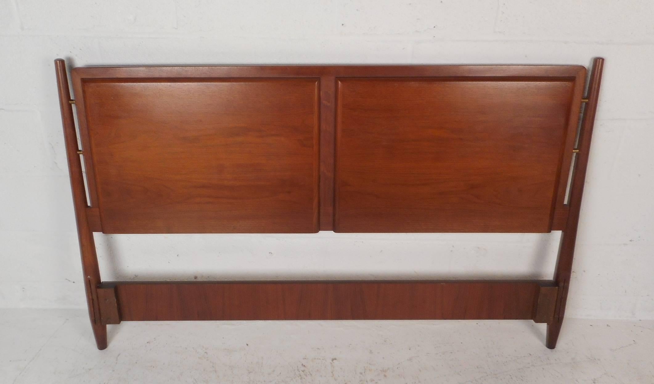 This stunning vintage modern full-size headboard features elegant walnut wood grain throughout. Embossed square sections above where your head lays add a unique quality. Two tapered cylindrical supports make this piece stand out. Please confirm item