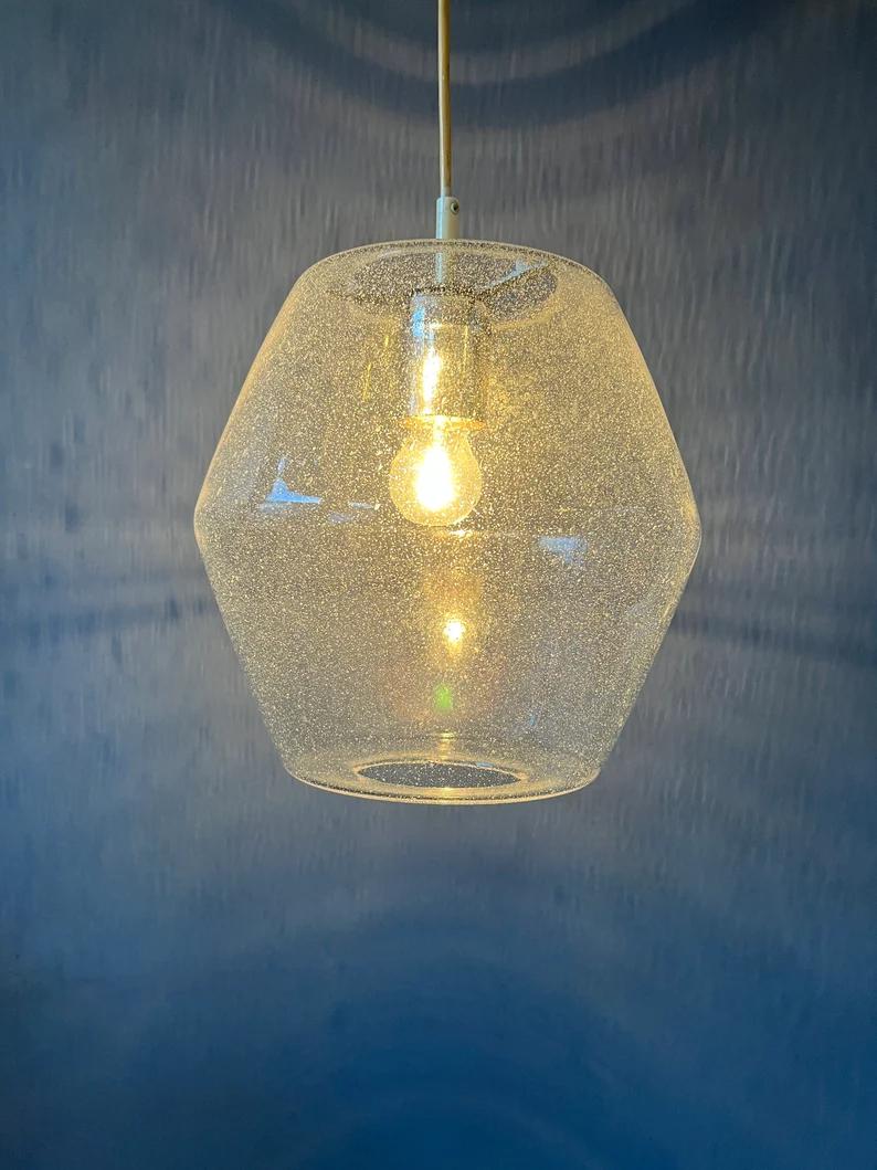 A very rare rare glass pendant by RAAK, model 'Kristall B1217'. This lamp is made of high-quality Venetian glass in a hexagon shape. The christal structure of the glass spreads the light nicely.

Additional information:
Materials: Glass,