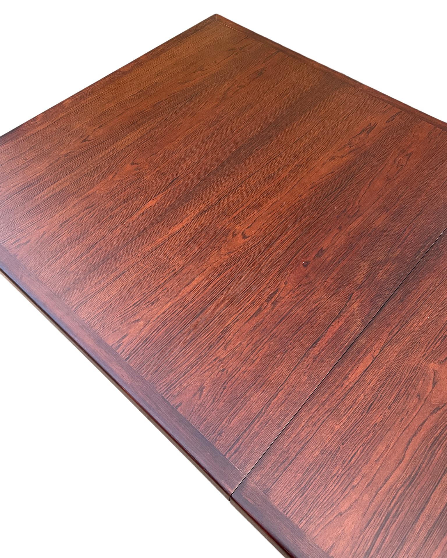 Midcentury Rare Solid minimalist Rosewood Expandable Dining Table with 1 Leaf In Good Condition For Sale In BROOKLYN, NY