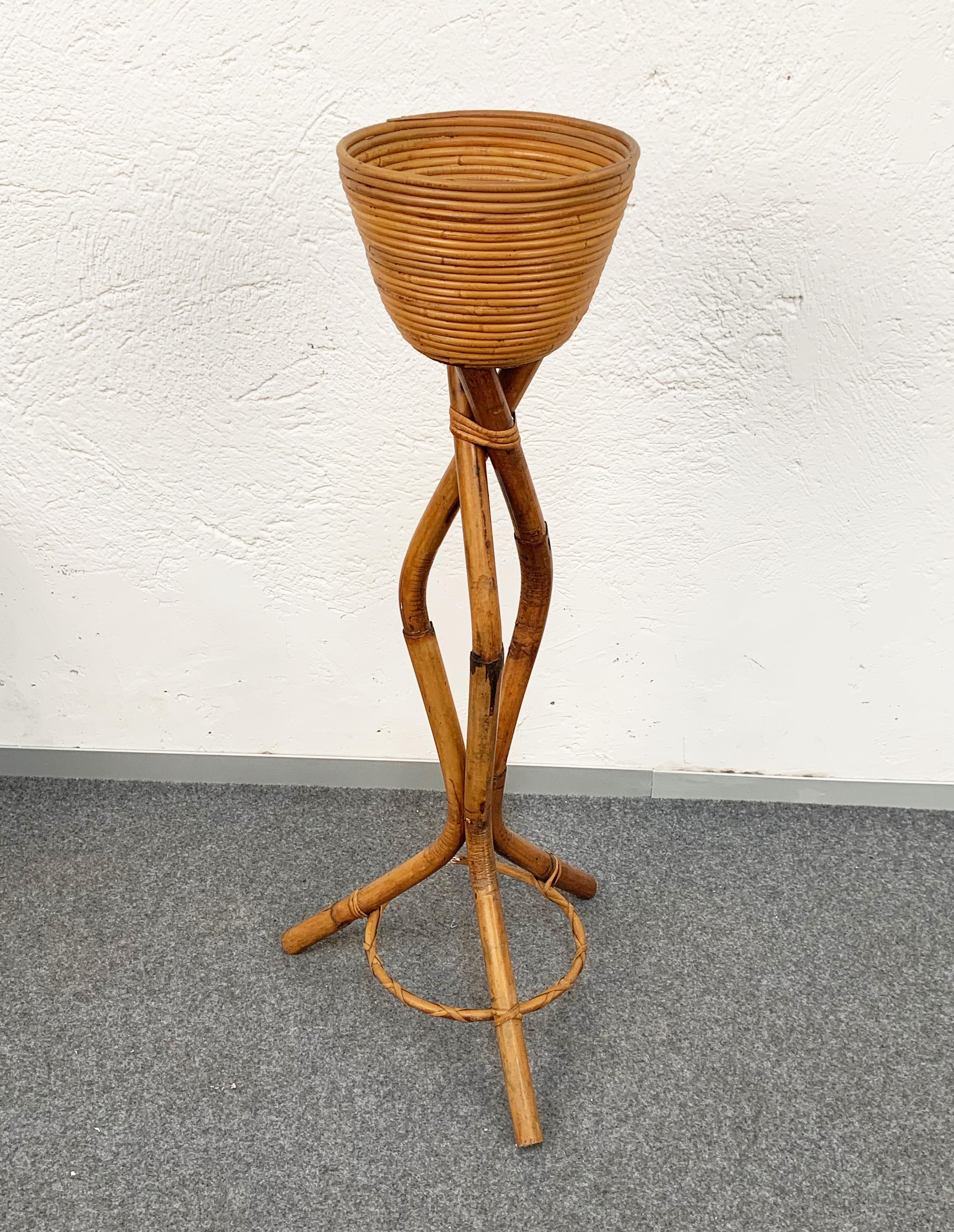 A fantastic Mid-Century Modern plant stand with a flower shelf in the style of Gabriella Crespi. 

A wonderful example of Italian midcentury production, circa 1950s, the item is a fine handmade work on rattan and bamboo.

This is a beautiful,