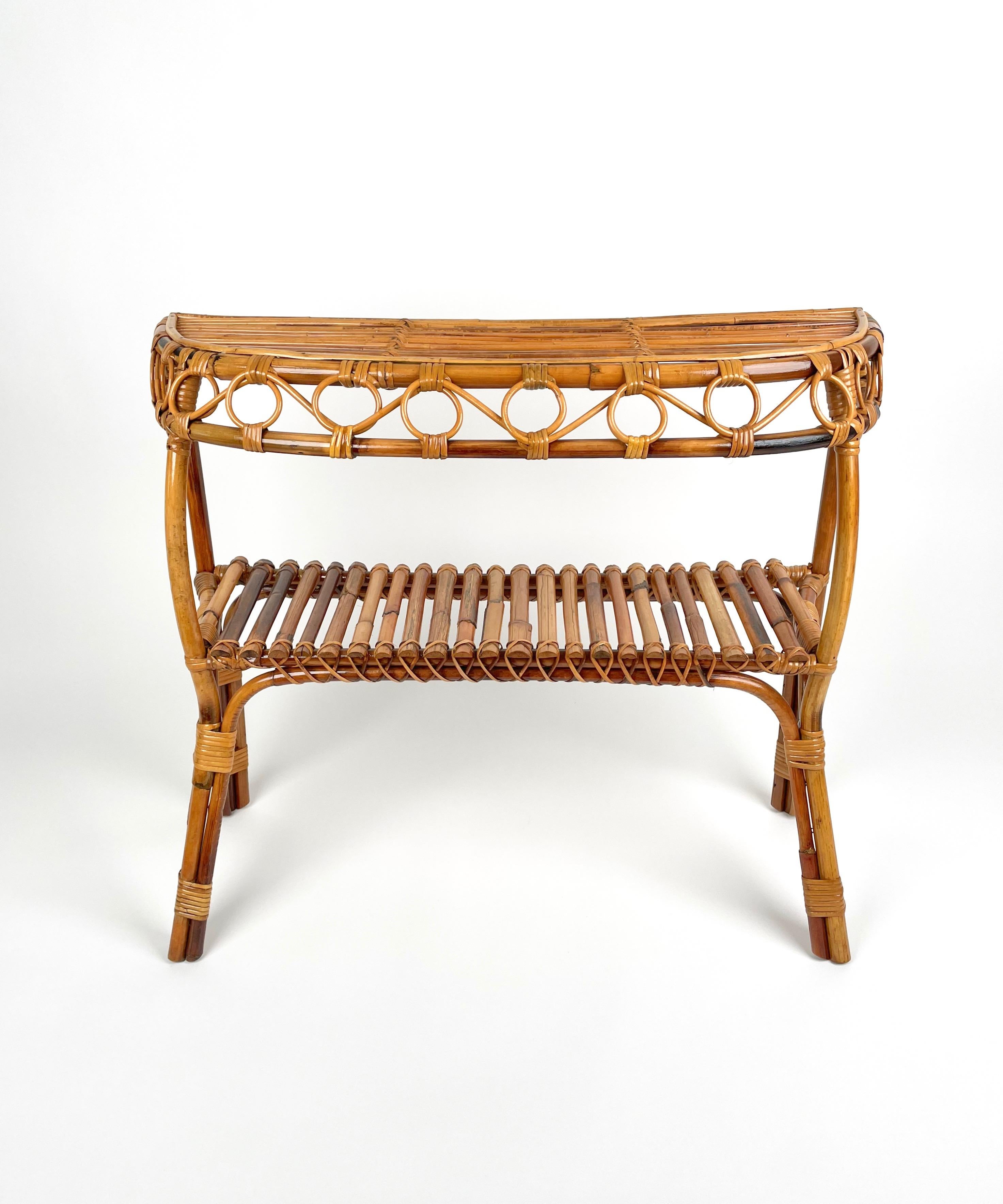 Console table in rattan featuring a lower shelf in the style of the Italian designer Franco Albini. 

Made in Italy in the 1960s.