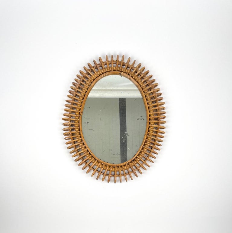 Charming oval wall mirror in woven bamboo & rattan.

Made in Italy in the 1960s.




