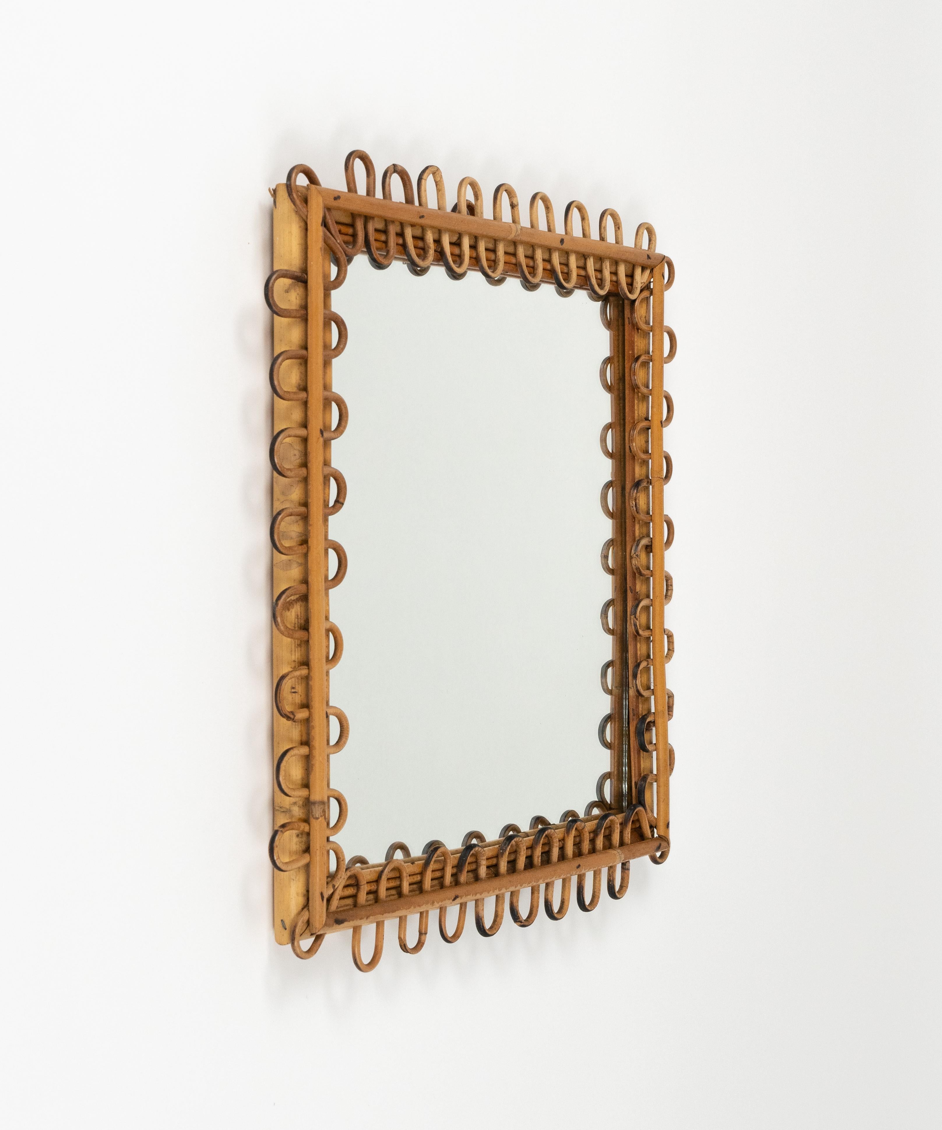 Midcentury beautiful squared wall mirror in bamboo and rattan in the style of Italian design Franco Albini.

Made in Italy in the 1960s.