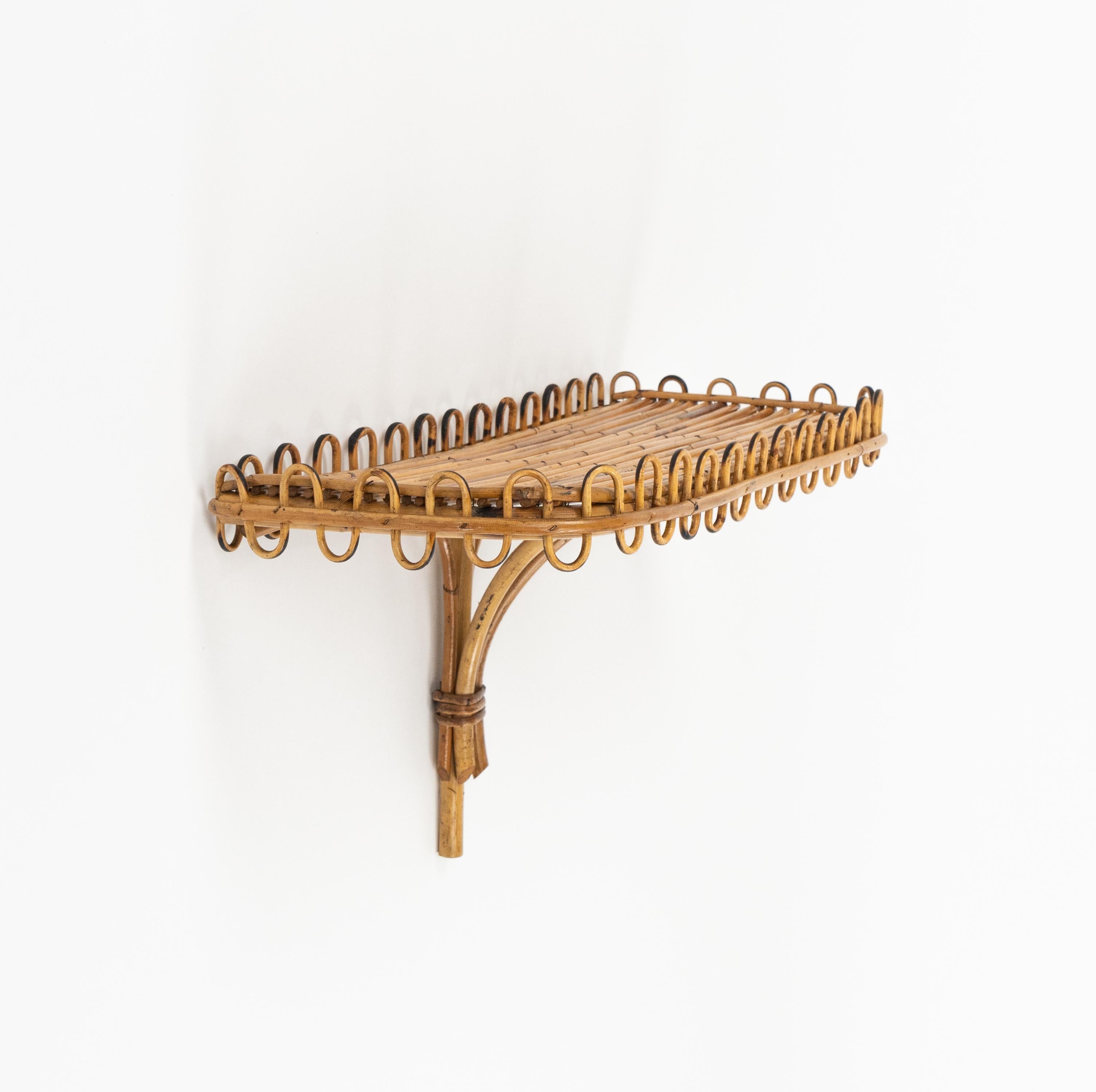 Midcentury amazing rectangular wall shelf or console in rattan and bamboo attributed to Franco Albini.   

Made in Italy in the 1960s.