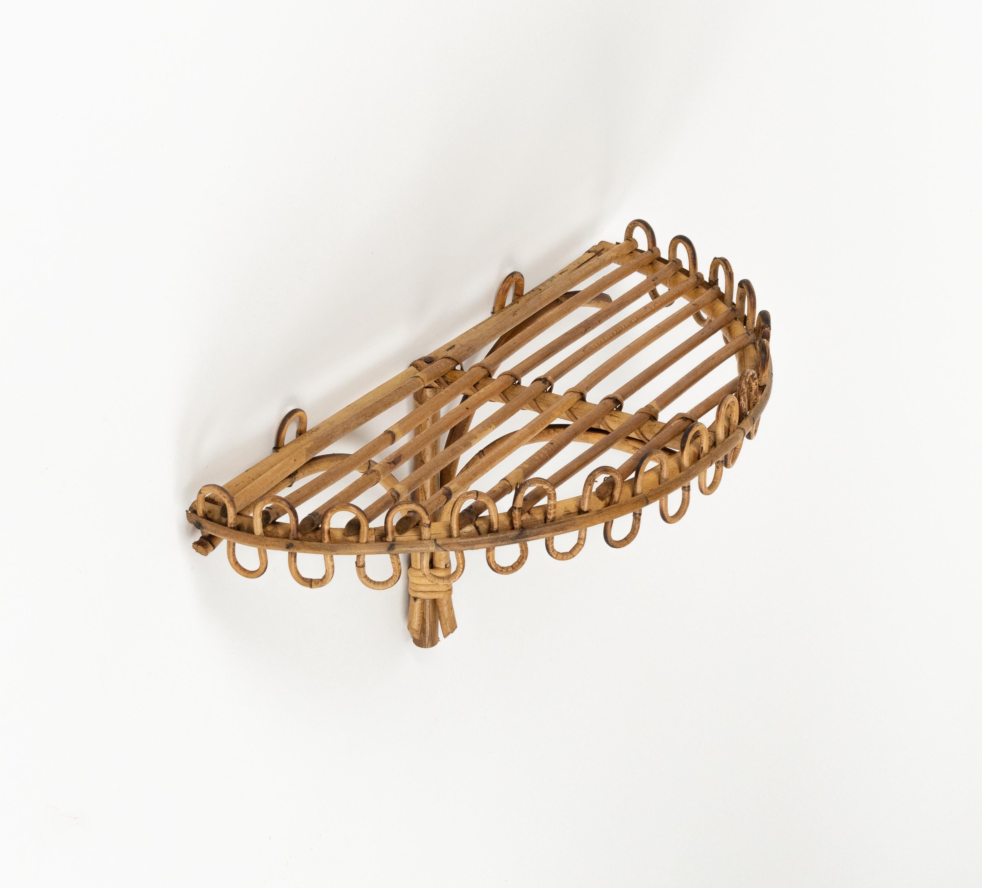 Midcentury beautiful rectangular wall shelf or console in rattan and bamboo attributed to Franco Albini.   

Made in Italy in the 1960s.