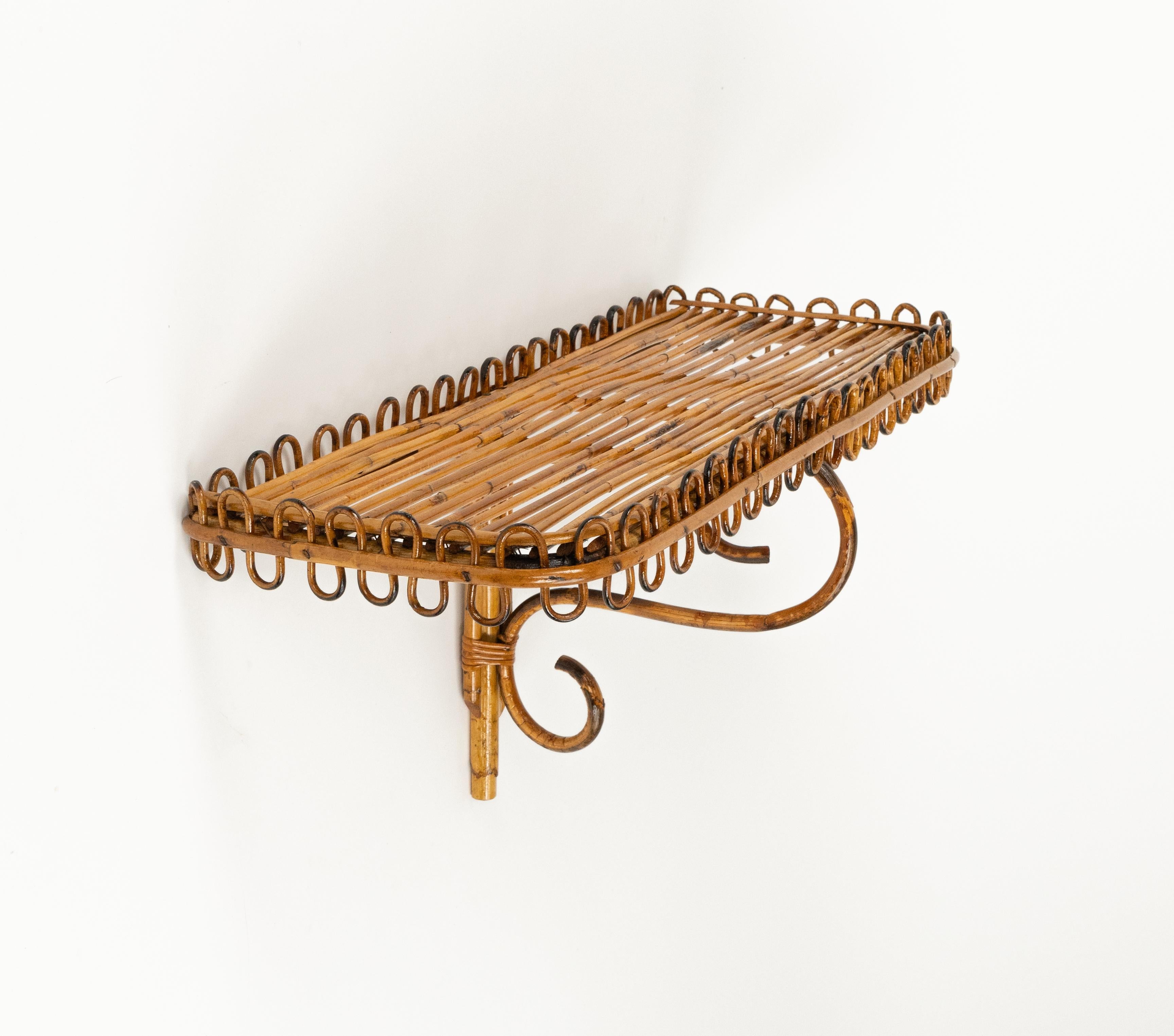 Midcentury amazing rectangular hand-crafted wall shelf or console in rattan and bamboo attributed to Franco Albini.   

Made in Italy in the 1960s.

Bamboo / rattan has been polished by a professional restorer.
