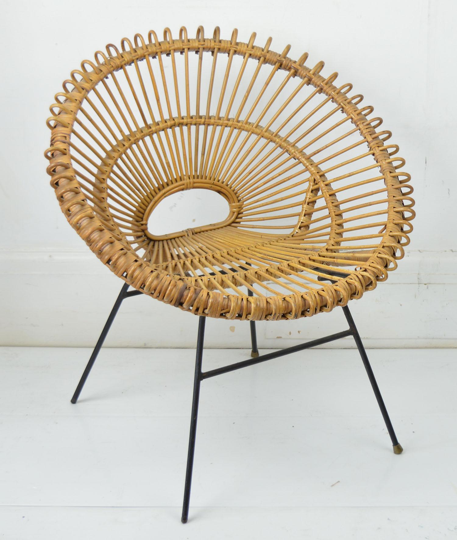 Very stylish chair.

Probably designed by Franco Albini.
 
Rattan and wrought iron.

Solid structure. It can be used to sit on.

Free shipping.

 