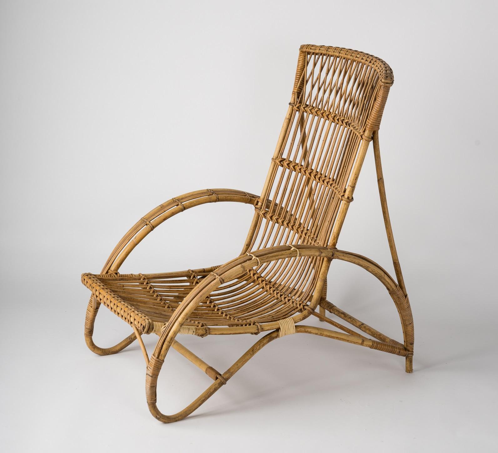 Midcentury rattan lounge chair in the style of Adrien Audoux and Frida Minet, French 1960s. Comfortable and in good vintage condition.