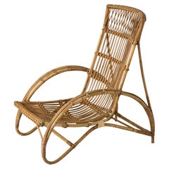 Rattan-Loungesessel aus der Mitte des Jahrhunderts im Stil von Audoux Minet, Frankreich, 1960er Jahre