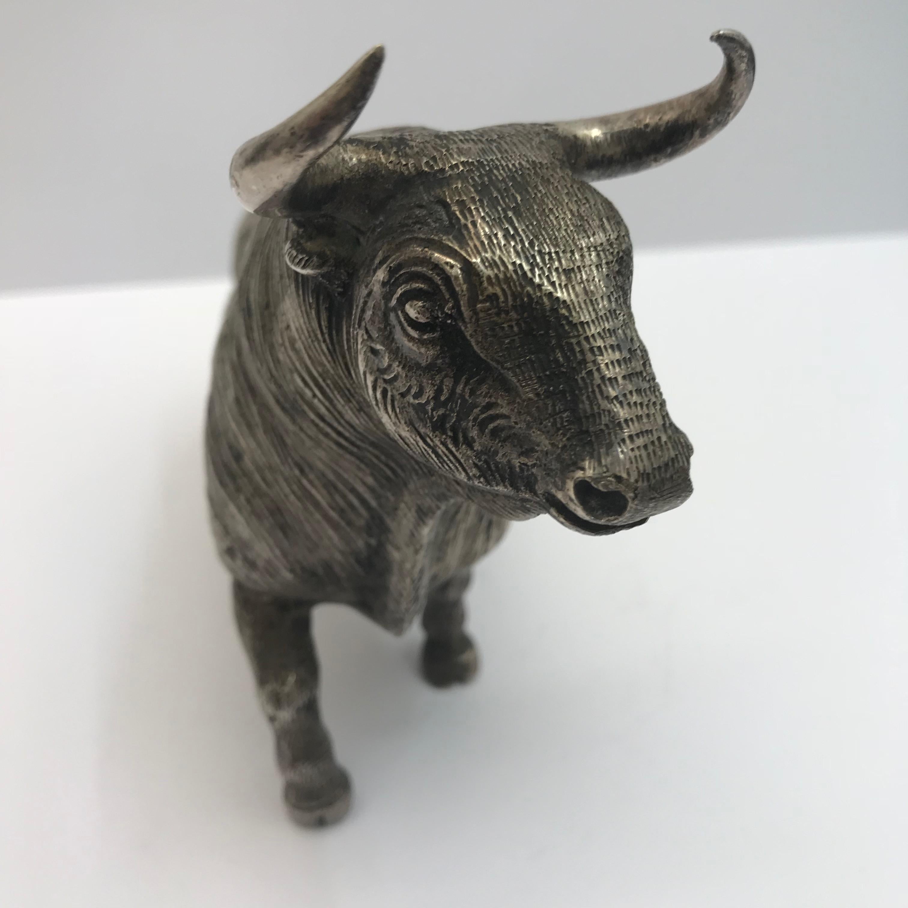 A Realistic silver plated model of a bull, in a proud stance, beautifully cast with great detail. 
Made circa 1950.