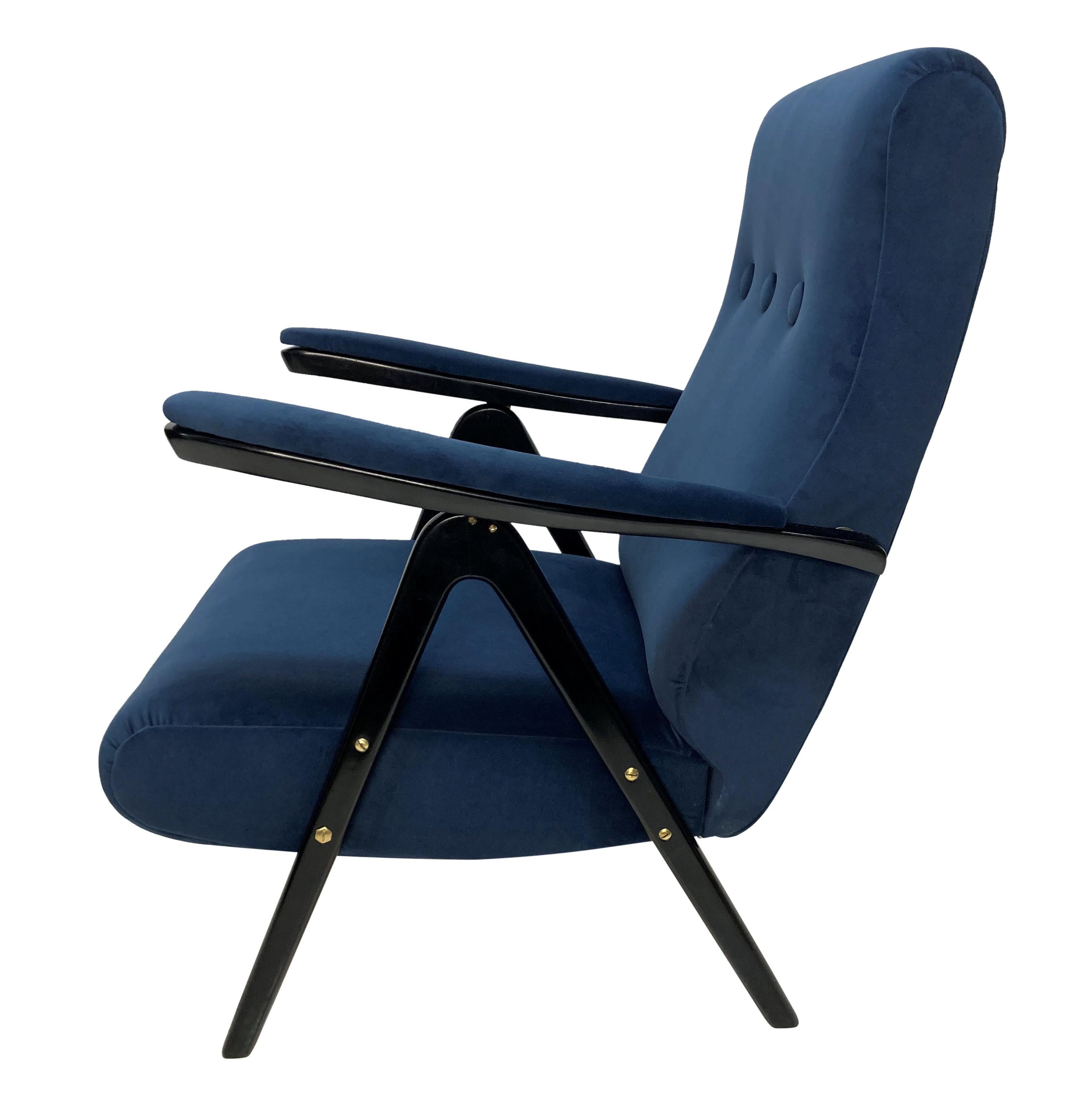 An Italian Mid-Century reclining armchair by Cassina, with ebonised frame and newly upholstered in blue velvet.
