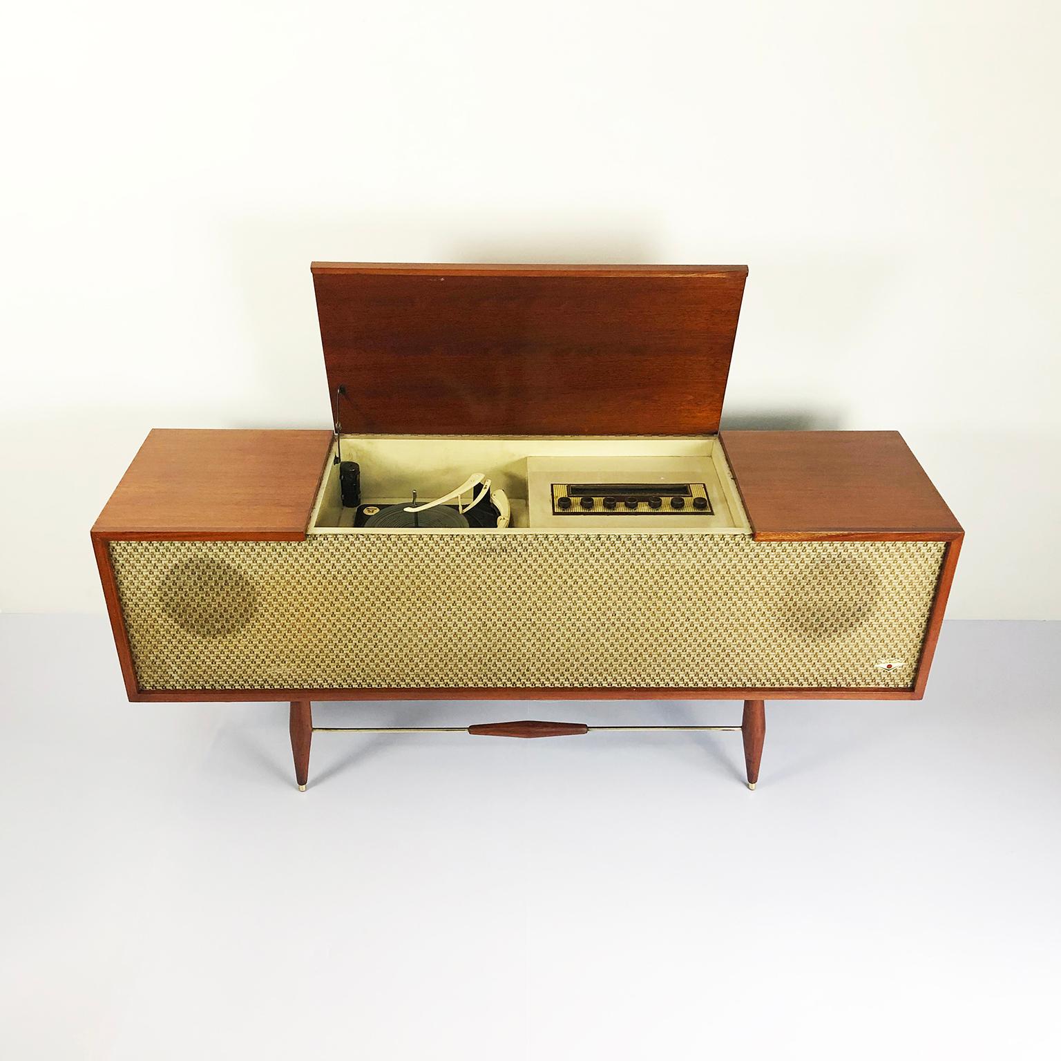 We offer this midcentury record player console in amazing vintage condition, the sound system works, circa 1950. Recently professionally restored.