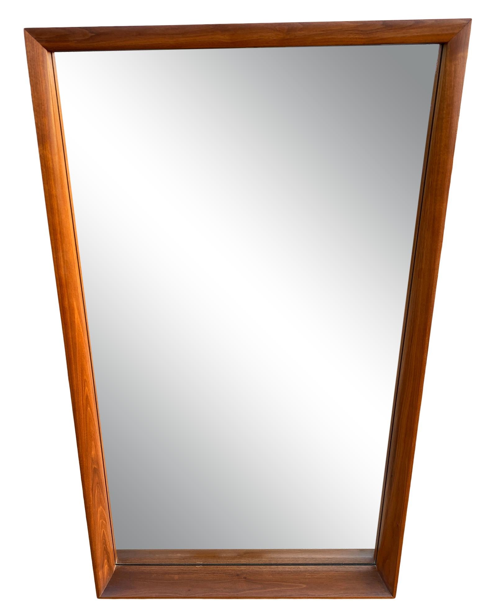 This wonderful Mid-Century Modern solid walnut mirror designed with amazing. Style of Nakashima, no label. Copper wire, wired to hang vertical. Beautiful vintage condition and great high quality woodworking. Finished back. Hand pencil marks, all