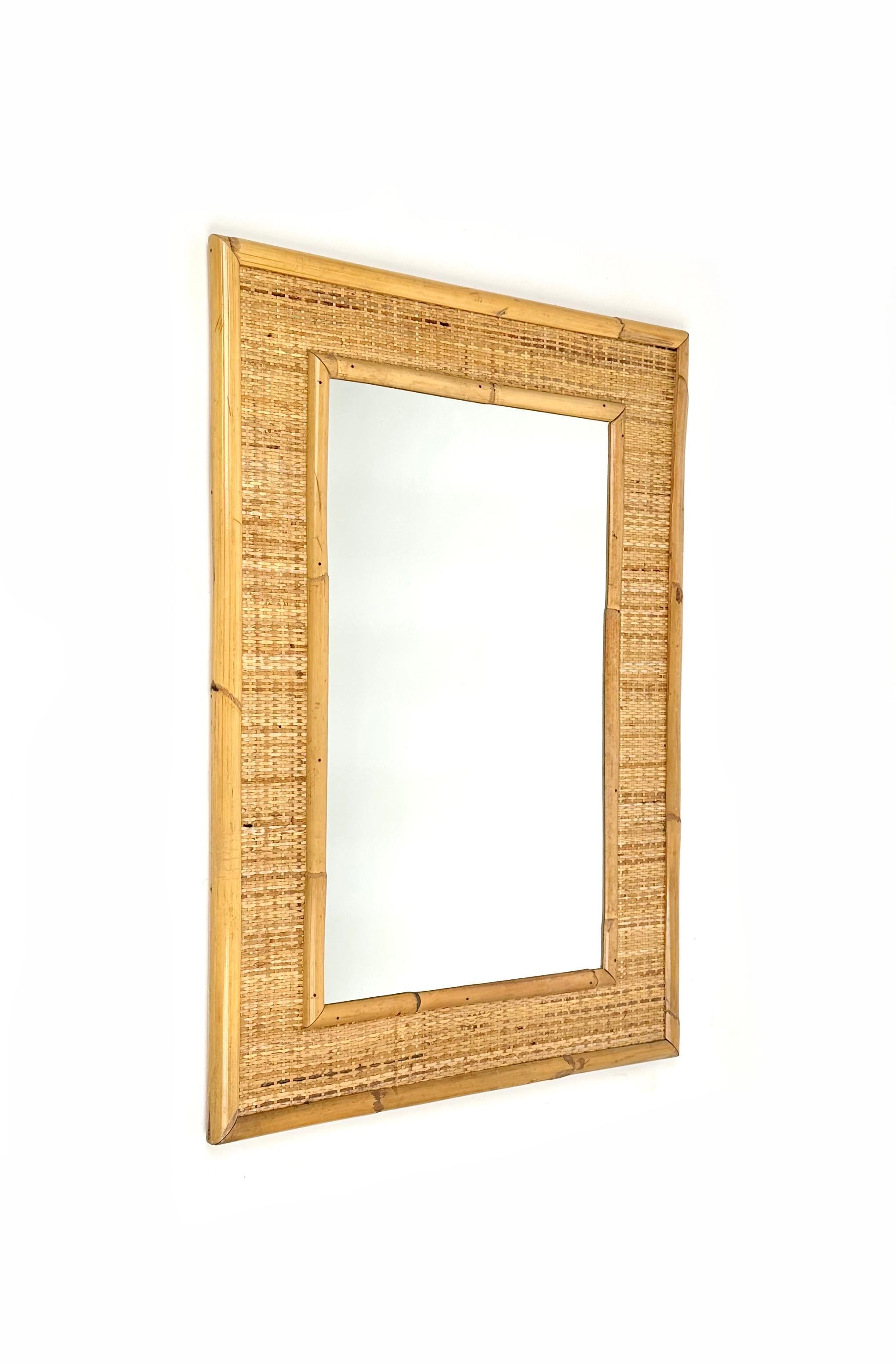 Midcentury rectangular wall mirror in bamboo and rattan.

Made in Italy in the 1960s.
