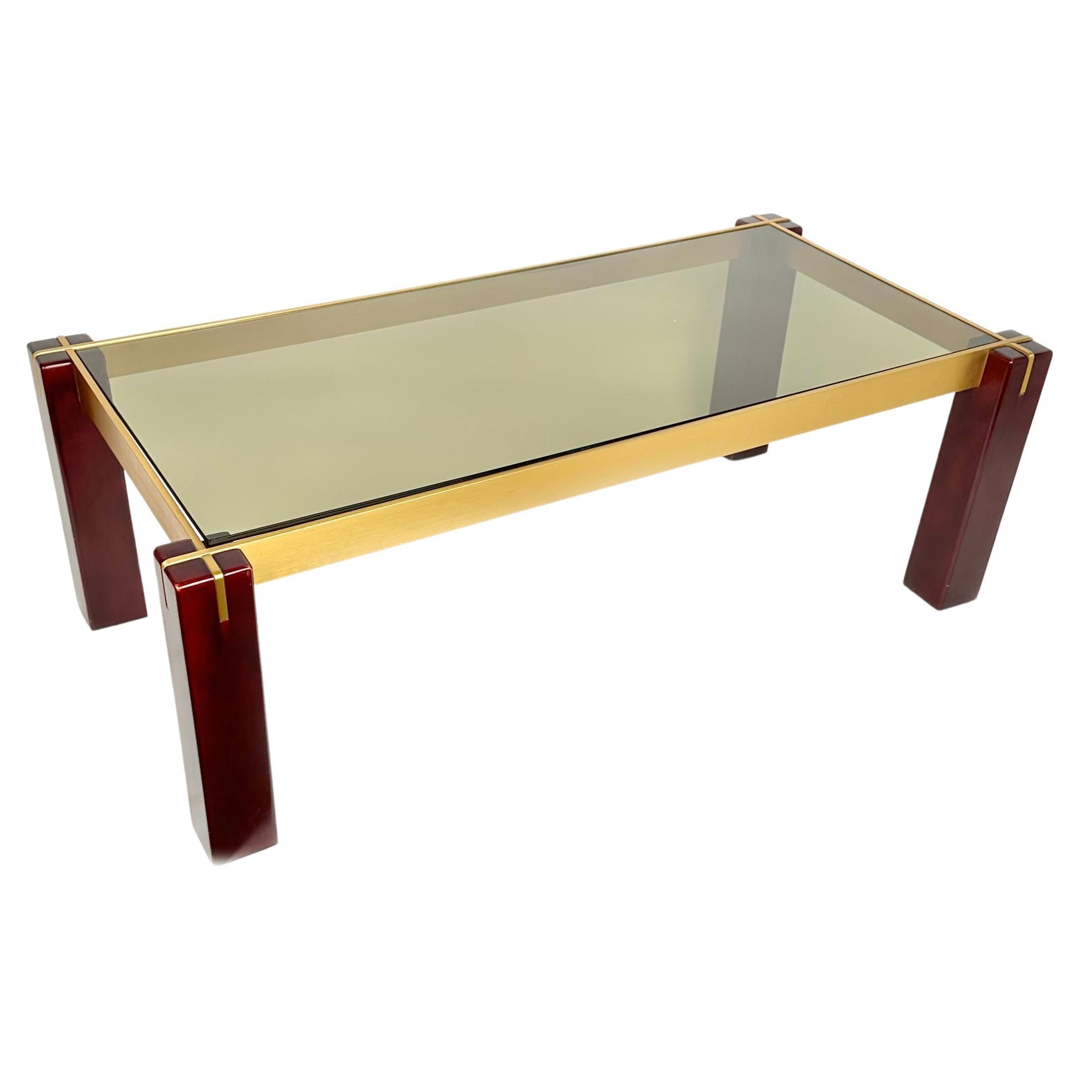 Mid-century rectangular coffee table in wood, brass and smoked glass.

Made in Italy in the 1960s.