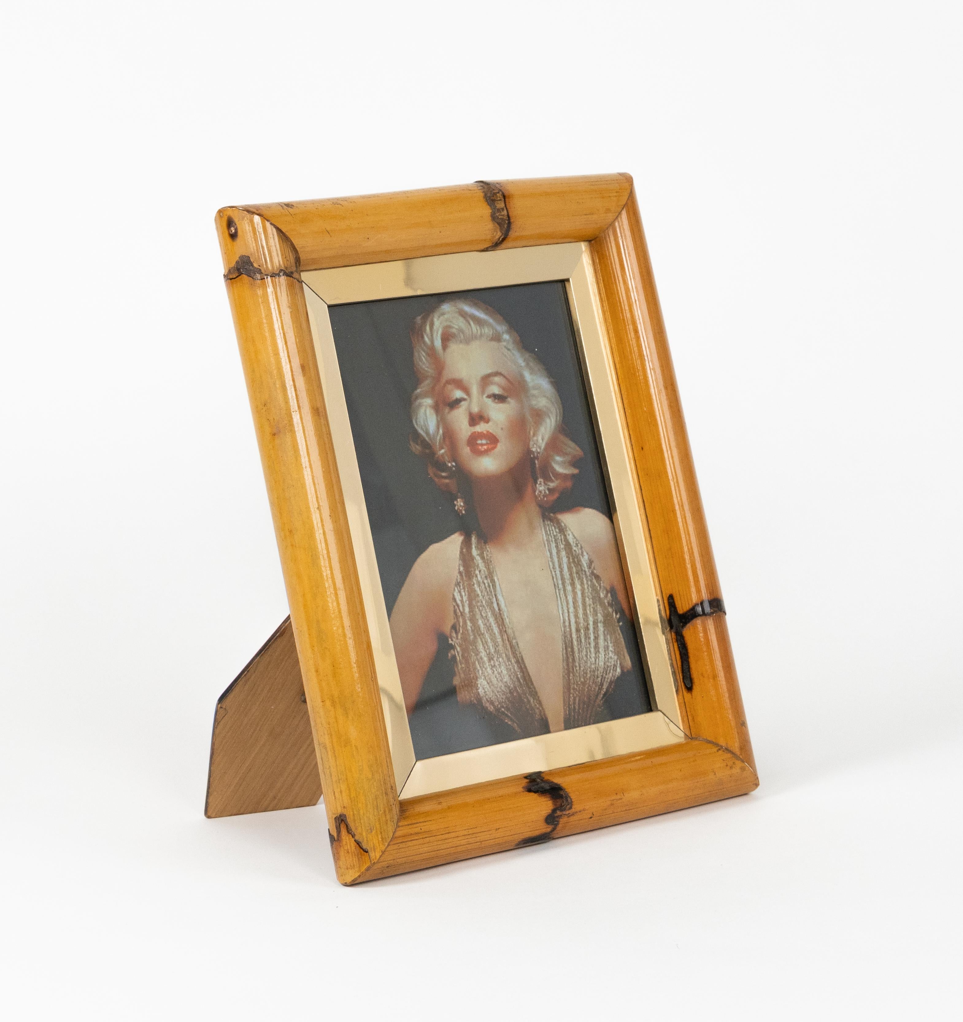 Midcentury beautiful rectangular picture frame in bamboo, brass and glass in the style of Gabriella Crespi.

Made in Italy in the 1970s.

This item is a wonderful addition to every modern home.