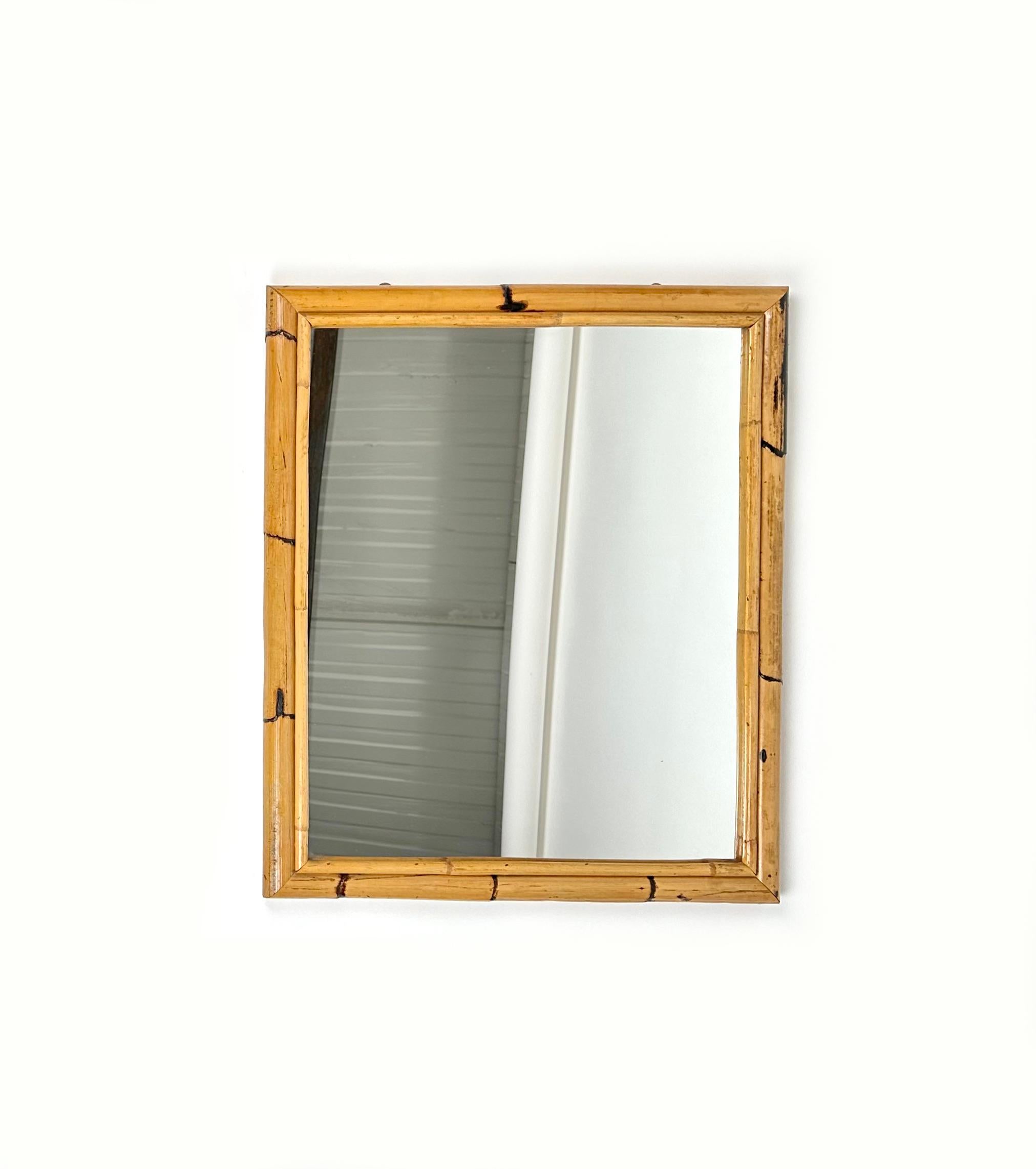 Beautiful rectangular wall mirror double Bamboo frame.

Made in Italy in the 1970s.