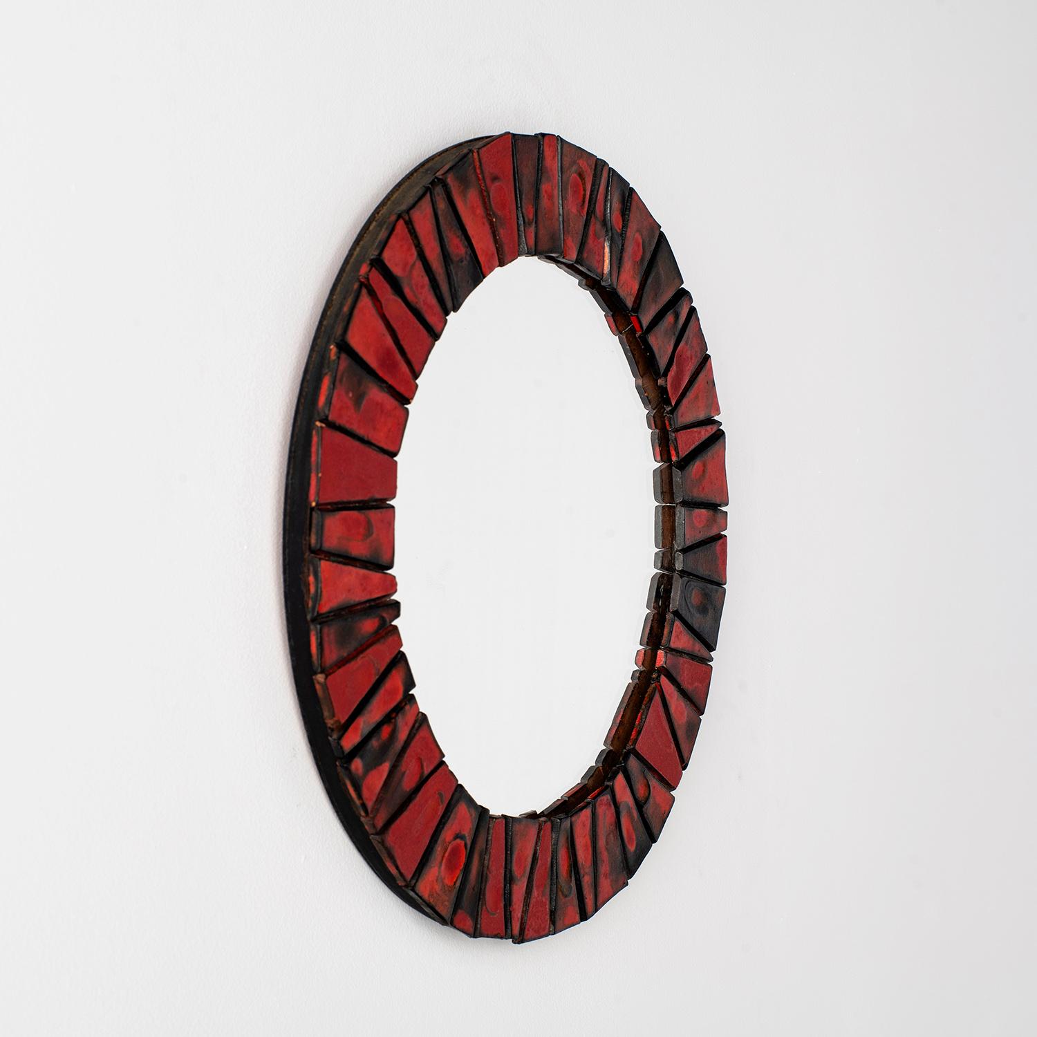 Organic Ceramic Tiled Mirror
Germany, circa 1970’s
Dynamic statement piece
Vibrant red and black lava pattern
Each tile has a unique swirl design
Light surface markings 
Patina from age and use