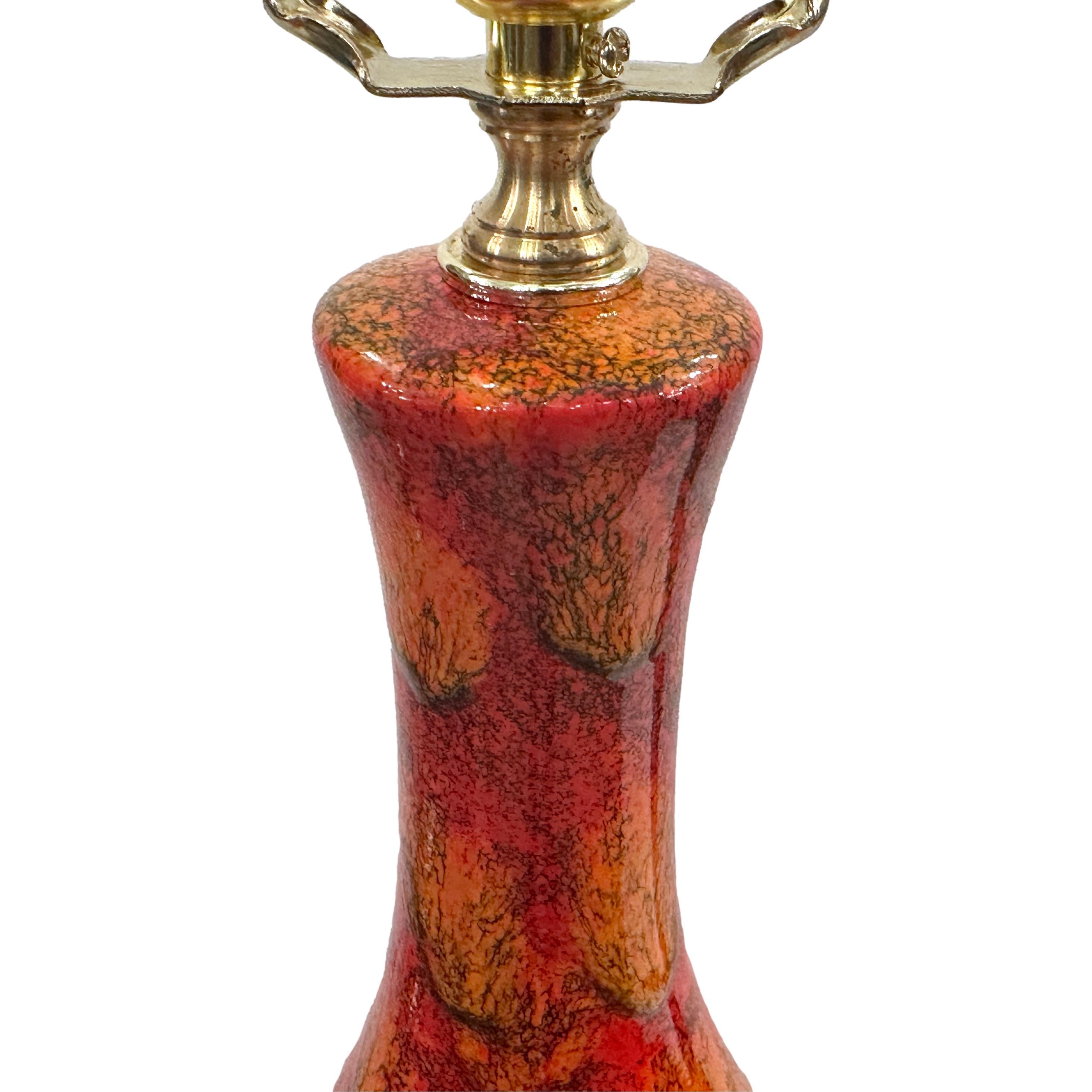 A circa 1960's Italian ceramic table lamp with red glazed finish.

Measurements:
Height of body: 19
