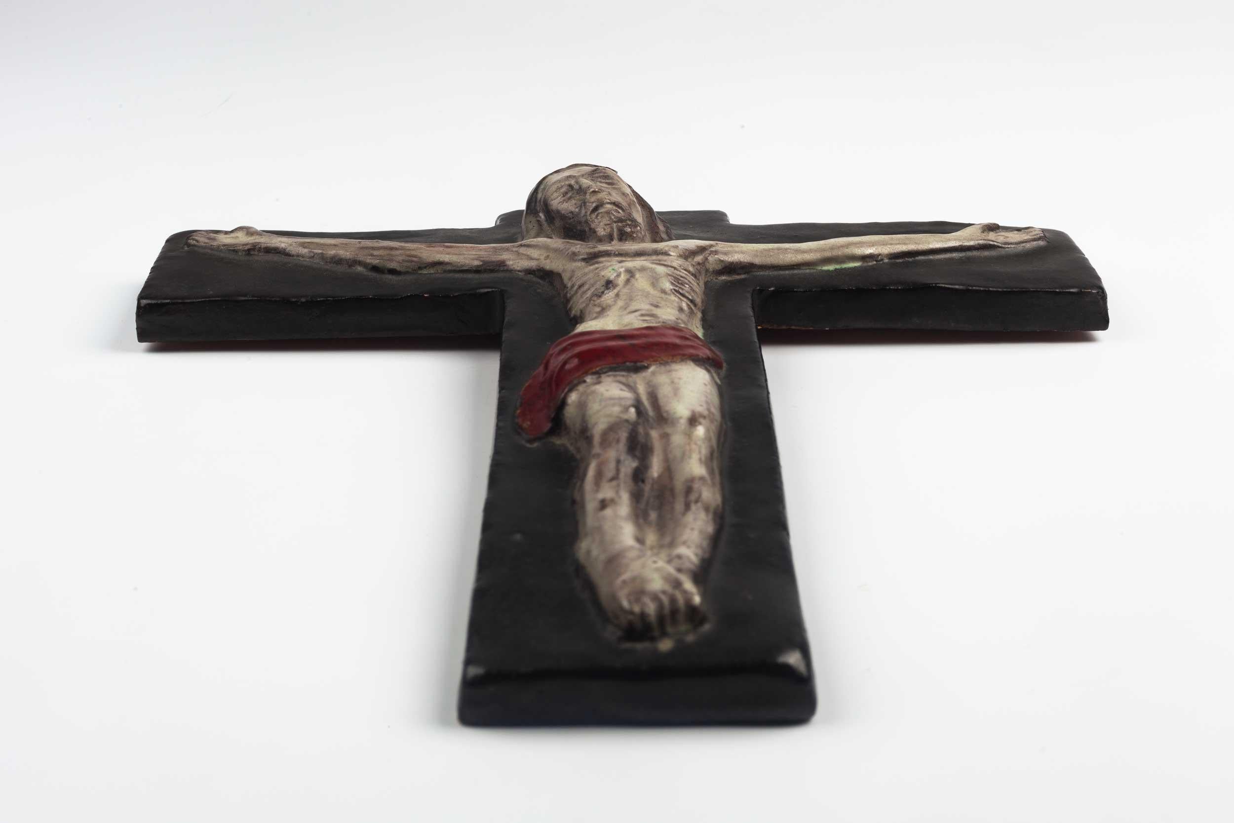 Midcentury European wall crucifix depicting Christ on the cross. From a large collection of vintage crosses handmade by Flemish artisans. 

From modernism to brutalism, the crosses in our collection range from being as futurist as a modernist