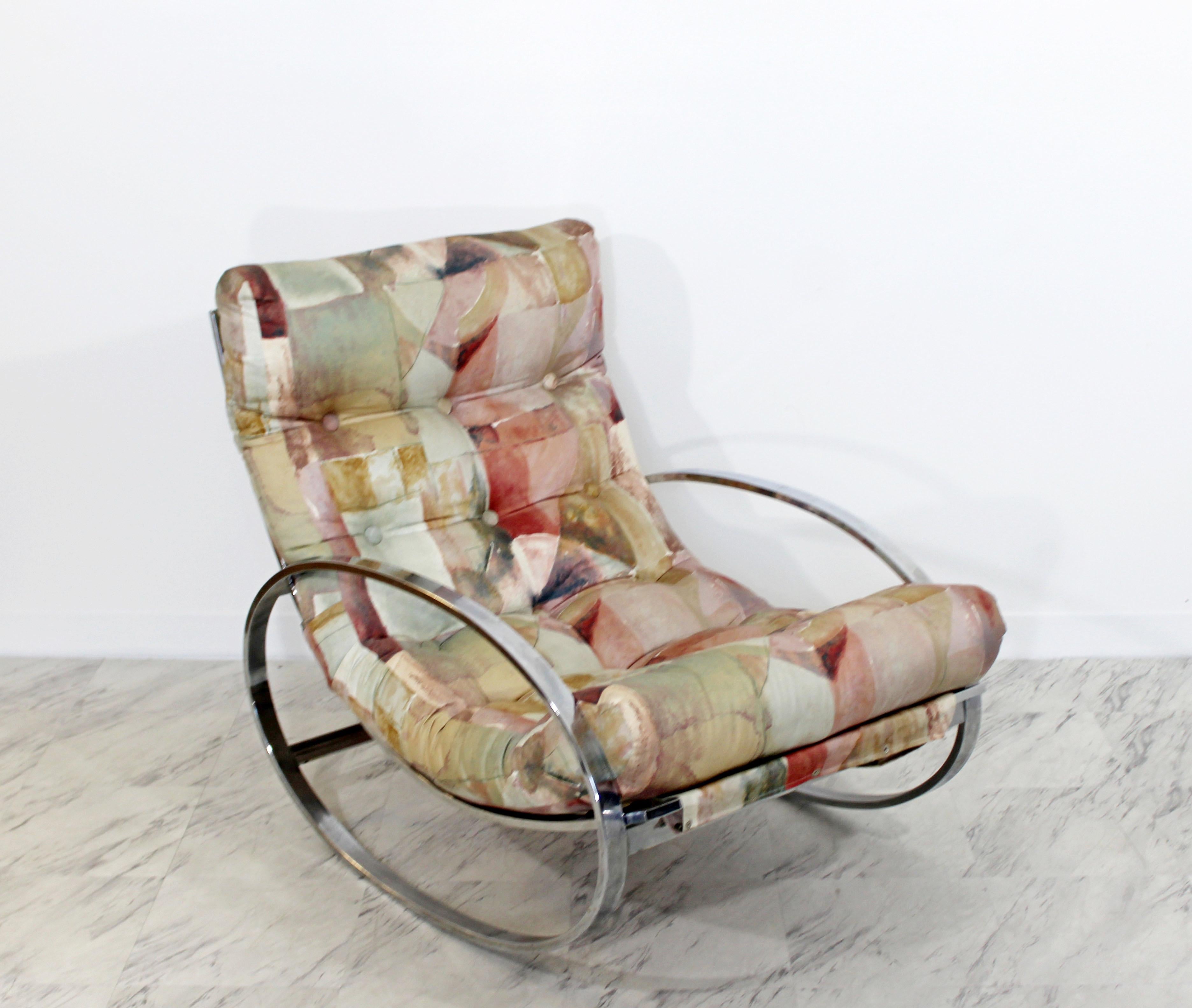 For your consideration is a fabulous, flat bar polished elliptical chrome rocker or rocking chair, with a floral upholstery, by Renato Zevi, made in Italy, circa 1970s. In excellent condition. The dimensions are 28