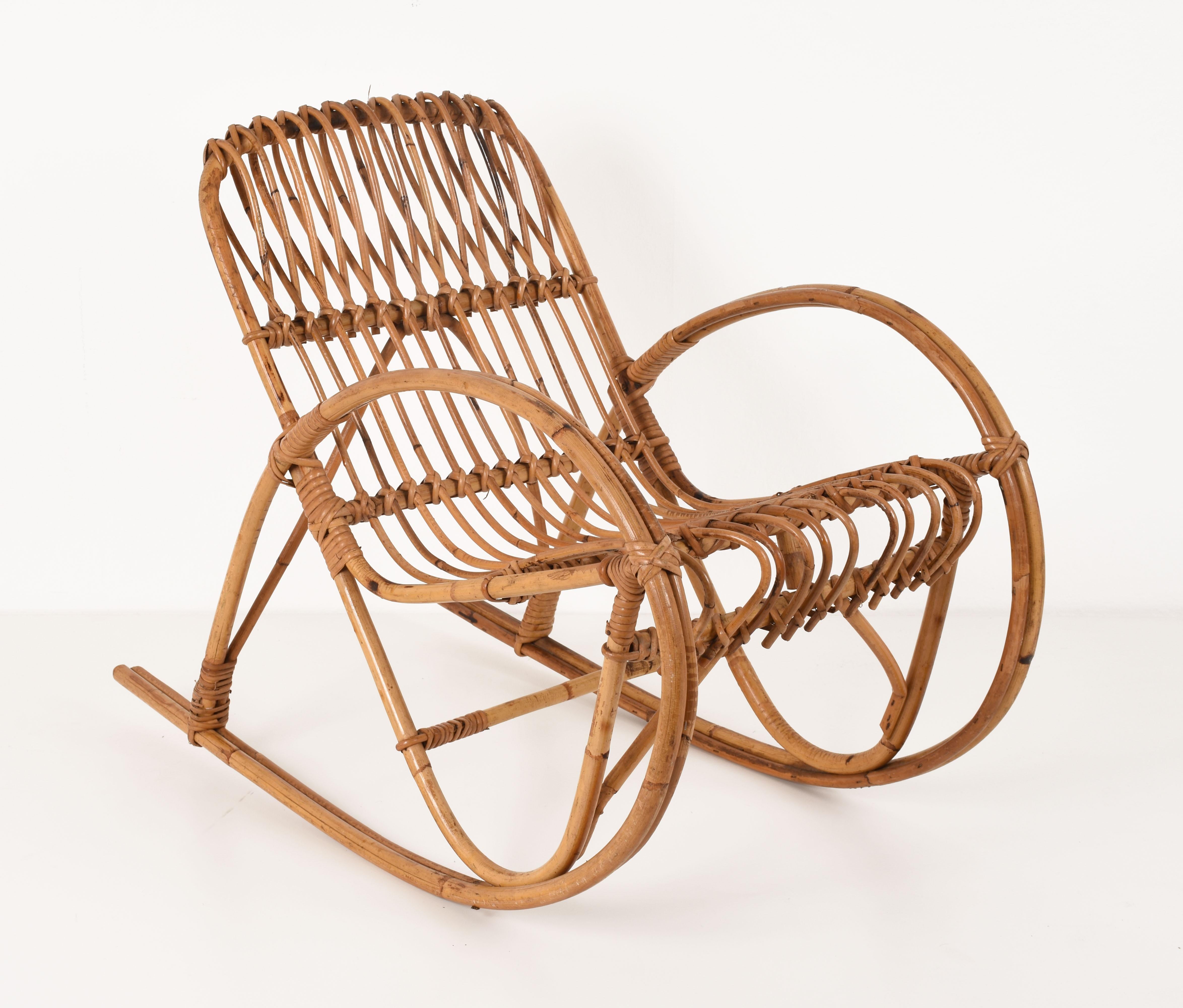 Elegant rocking chair for children, manufactured in Italy during the 1950s. 

The chair is in folded rattan, with beautiful details and in very good condition. It is perfect for a little child playroom or bedroom. 

This chair is unique because