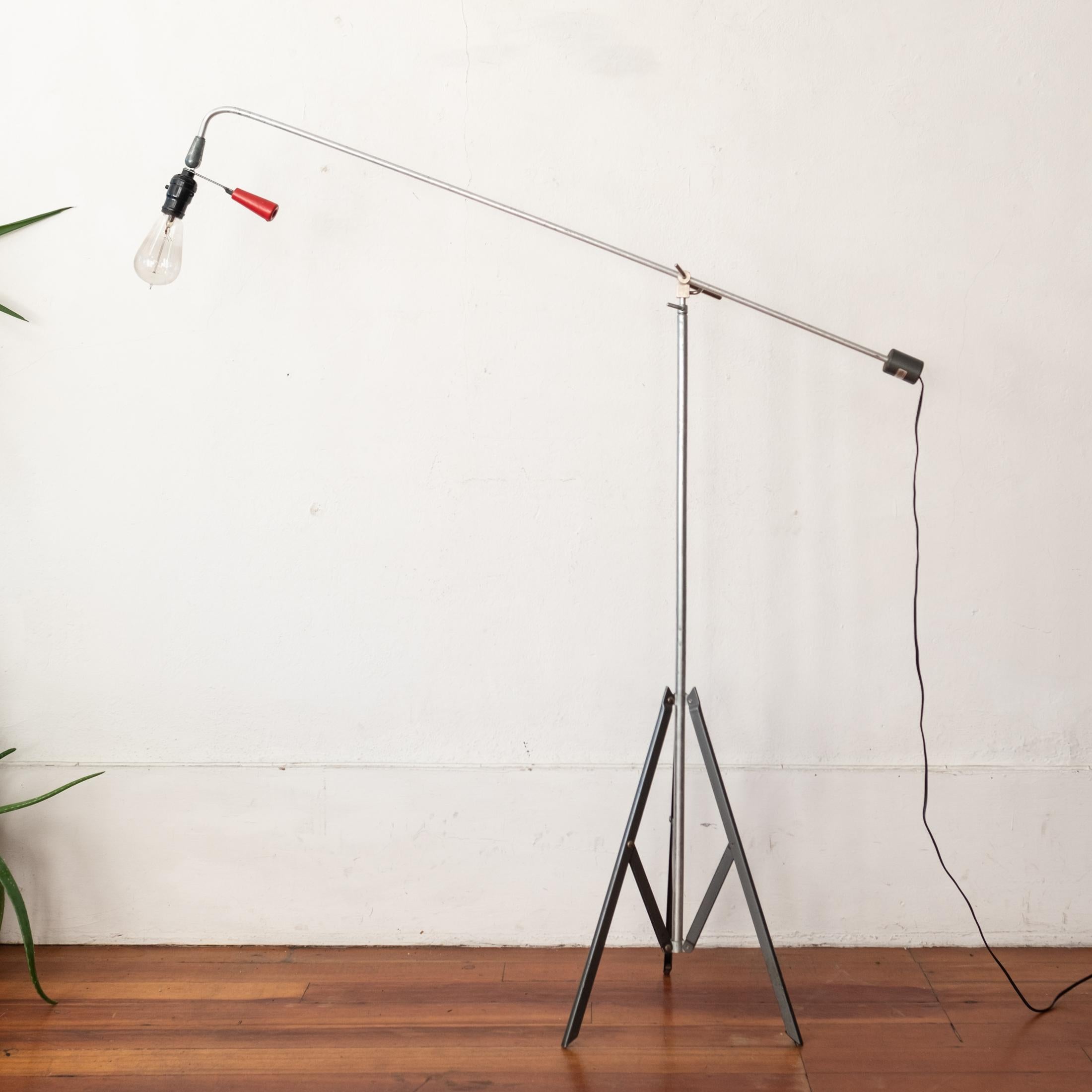 Roland Smith floor lamp by Smith-Victor Corporation USA, c. 1945 Fully adjustable and breaks down for easy storage. 

Nickel-plated steel, aluminum, steel, plastic, lacquered wood

Measures: 43