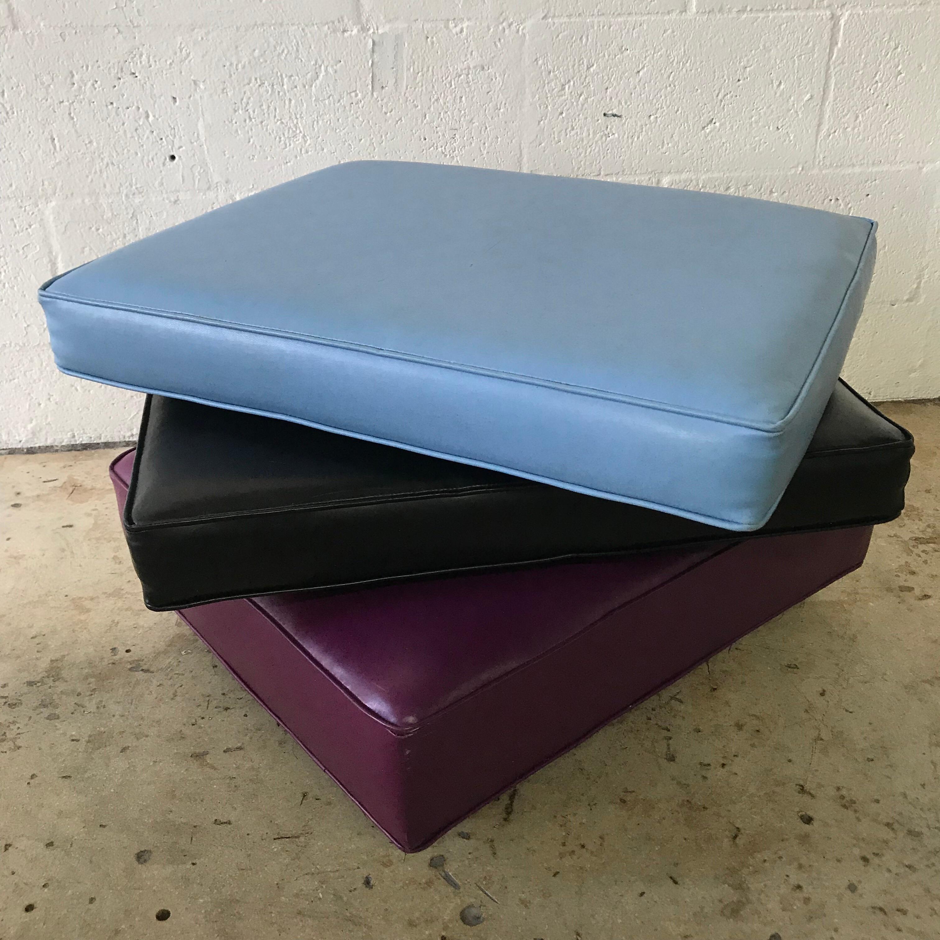 Vintage midcentury rolling ottoman floor cushion set rendered in 3 colors of vinyl faux leather.