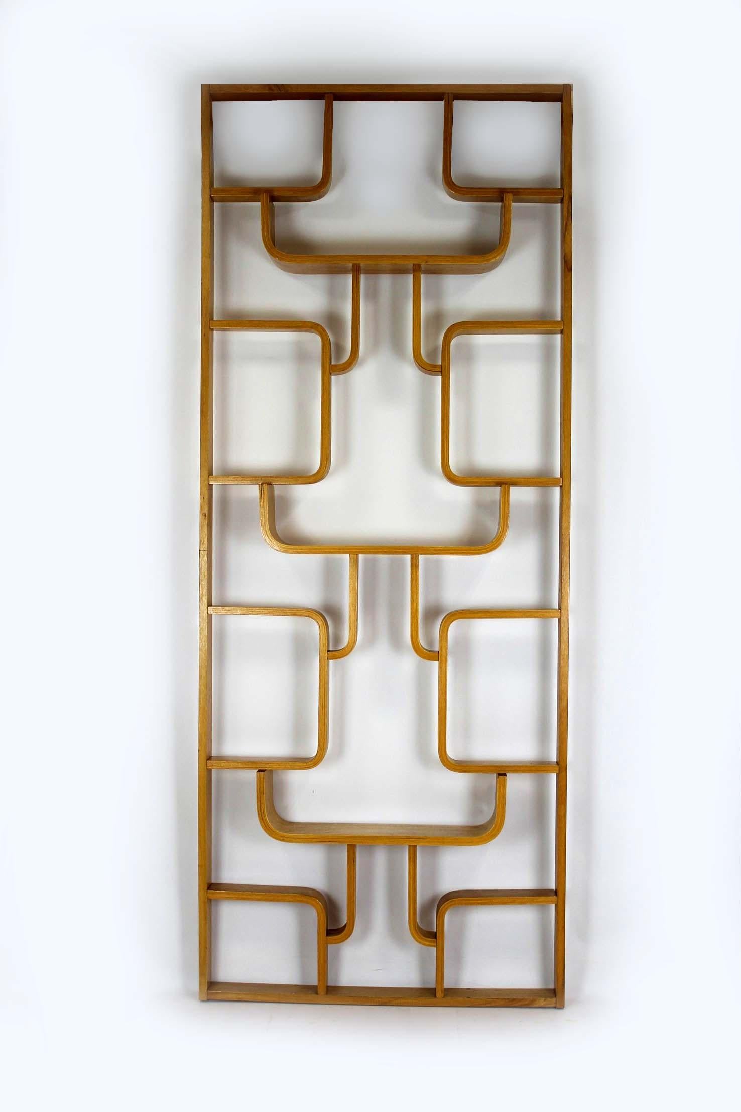 This room divider was designed by Ludvik Volák for Dřevopodnik Holešov in the 1960s.
It is made of beautifully curved, veneered plywood — a signature of mid-century Czechoslovak design.
The piece has been preserved in good original condition, with a