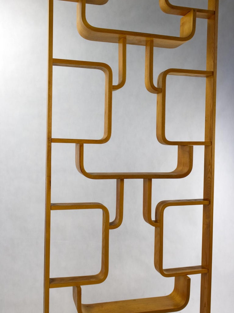 Midcentury wall divider designed by Czech architect, Ludvik Volak and produced by Drevopodnik Holešov in the former Czechoslovakia in the 1960s, made of the bent beech plywood and features geometric patterns. In a good original condition.