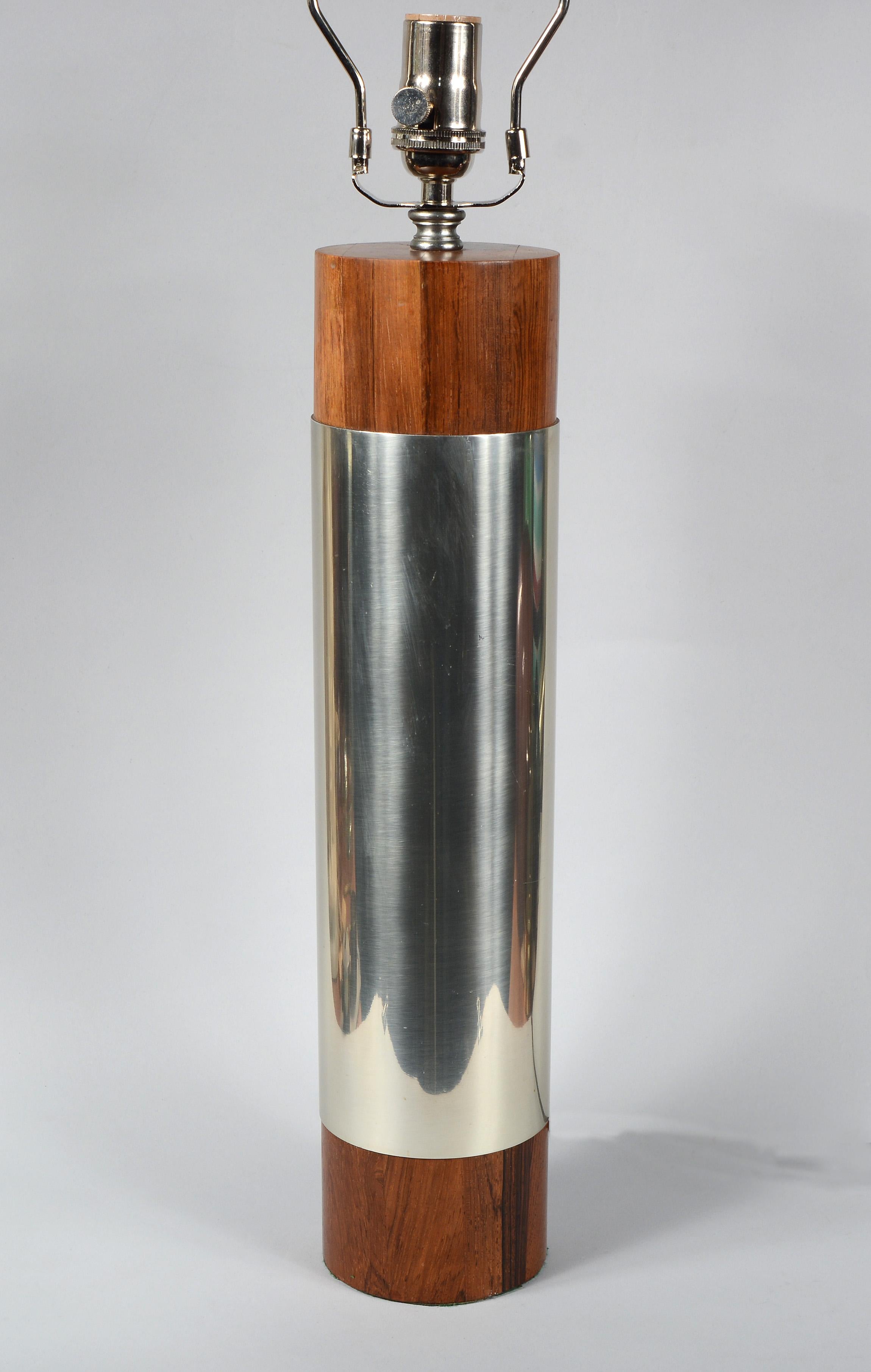 Cylindrical table lamp in rosewood and aluminum. This has solid rosewood top and bottom with a polished aluminum cylinder in between. The height given is to the top of the harp. The height to the bottom of the socket is 18