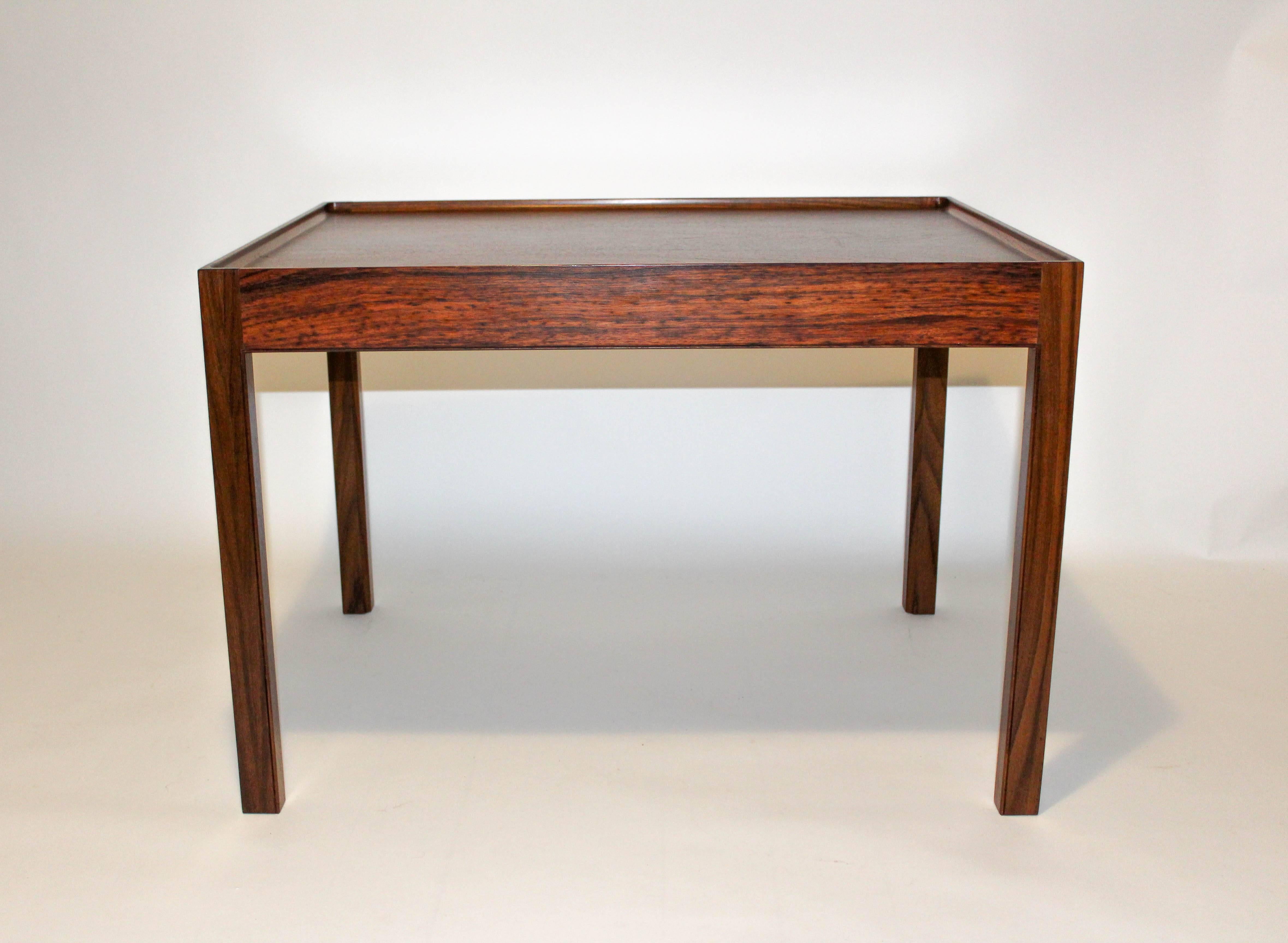 Midcentury Danish rosewood coffee table with elevated edges by Eric Christian Sørensen. The table is in very good vintage condition. Labeled BOEX.