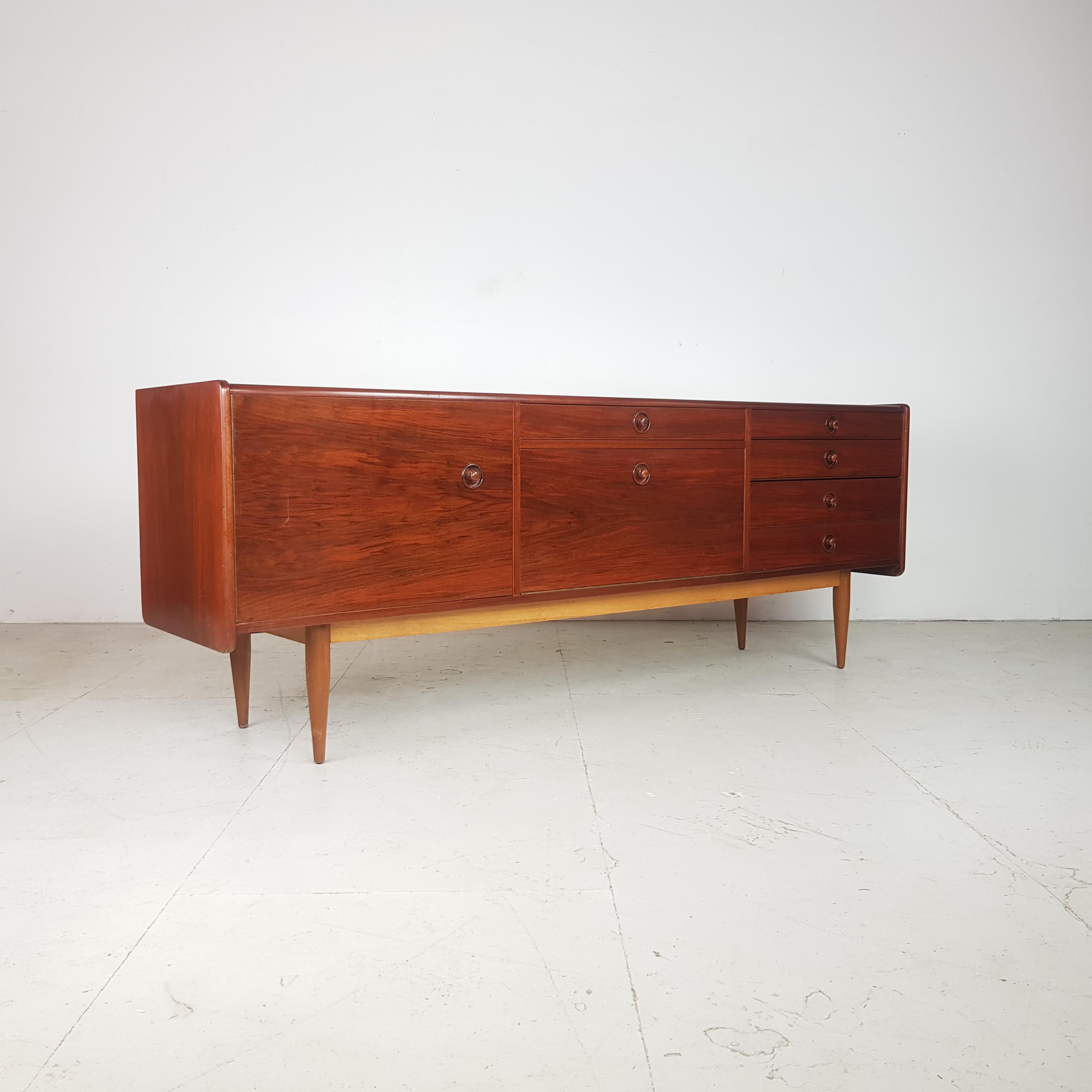 Midcentury rosewood sideboard with lots of storage from Denmark.

In good vintage condition midcentury rosewood sideboard with lots of storage from Denmark.

In good vintage condition.