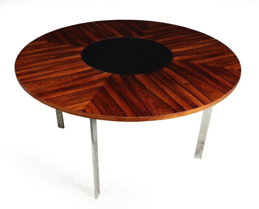 A stunning table produced by Merrow Associates in the 1960s, this rosewood topped dining table has a black laminate lazy susan in the center, the top has been re finished and is in excellent condition, the laminate has been replaced and new, the