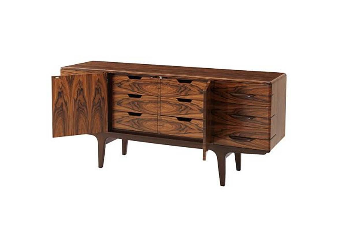 Mid-Century Modern rosewood veneered dresser drawers with six exterior showing drawers and six interior hidden cabinet drawers with self-closing drawers and mahogany base runner.