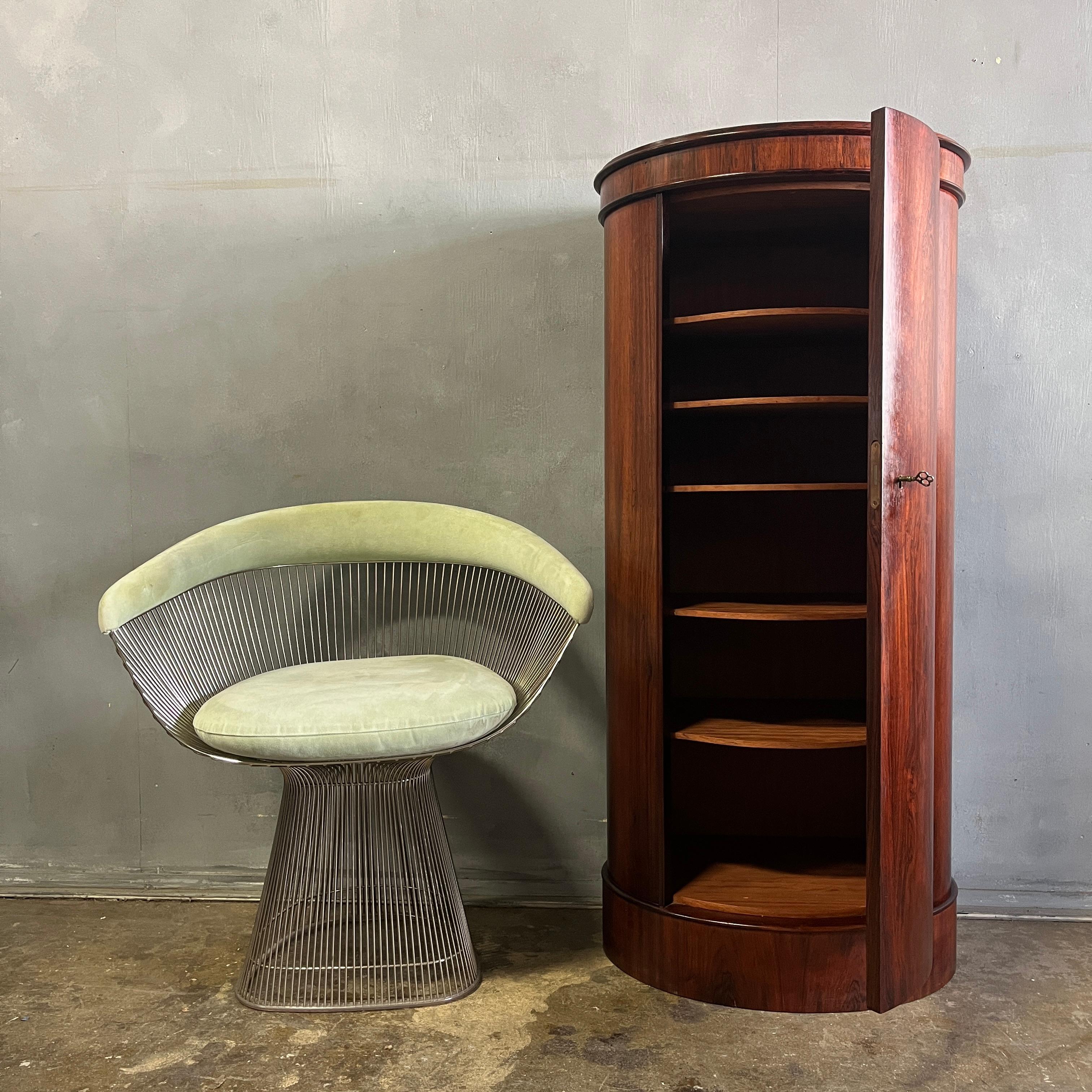 Danish Modern Oval Pedestal cabinet designed by Johannes Sorth produced by Bornholm in Denmark, circa 1960s. Features five interior shelves in addition to the base shelf. Perfect storage for your dining room. This unique drum cabinet fits well with