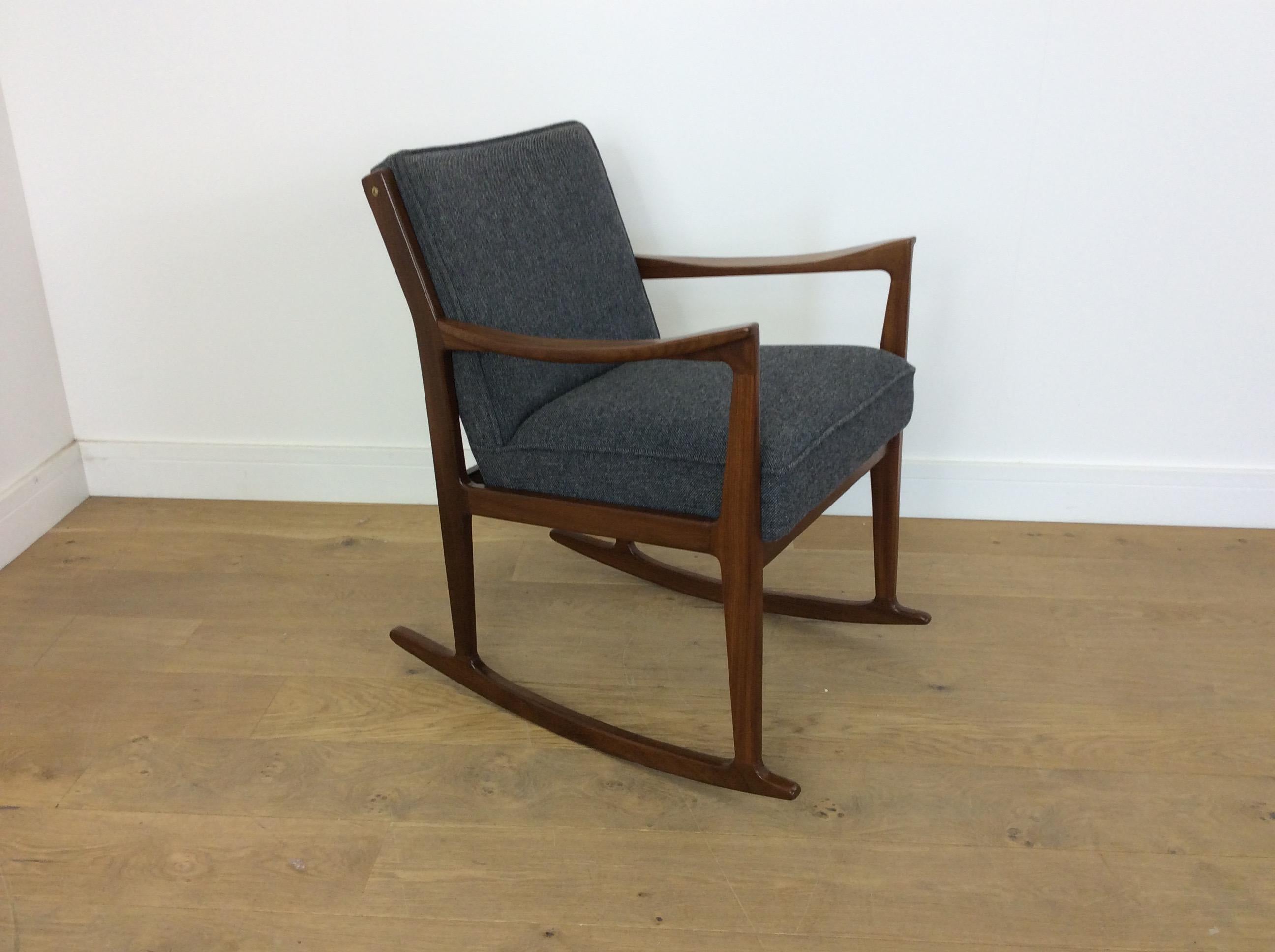 Midcentury rosewood rocking chair.
Mid-Century Modern design rocking chair newly upholstered in a grey fabric.
Danish, circa 1960
Measures: 78 cm H, 59 cm W, 63 cm D, seat H 52 cm, seat D 44 cm.