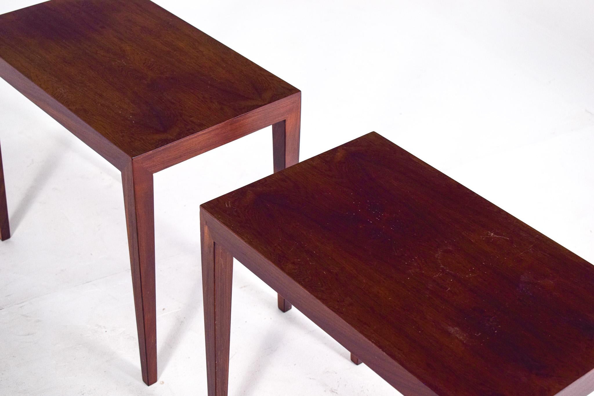A pair of rosewood side tables with beautiful handcrafted details designed by Erik Severin Hansen and produced in Denmark by Haslev in the 1960s. Pure and elegant shaped tables with have lovely wood grain. This tables can work in the bedroom as