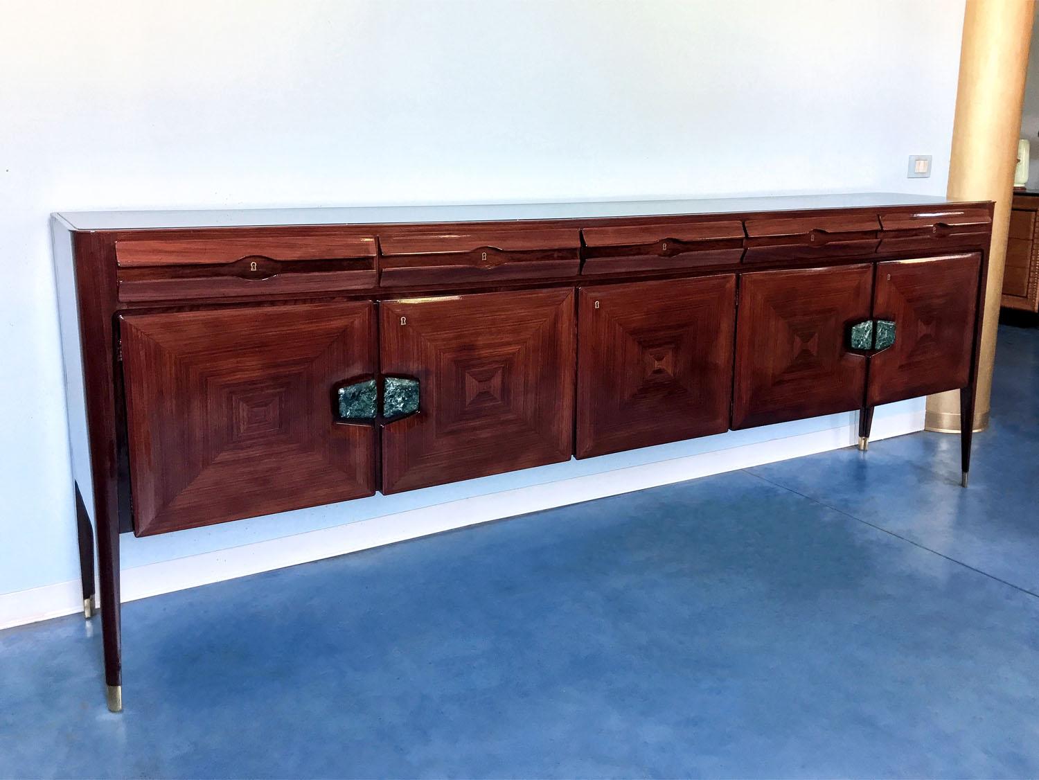 Stylish Italian sideboard designed by Vittorio Dassi in the 1950s, finished with fine marble handles.
In very good conditions of the period, it was recently restored.