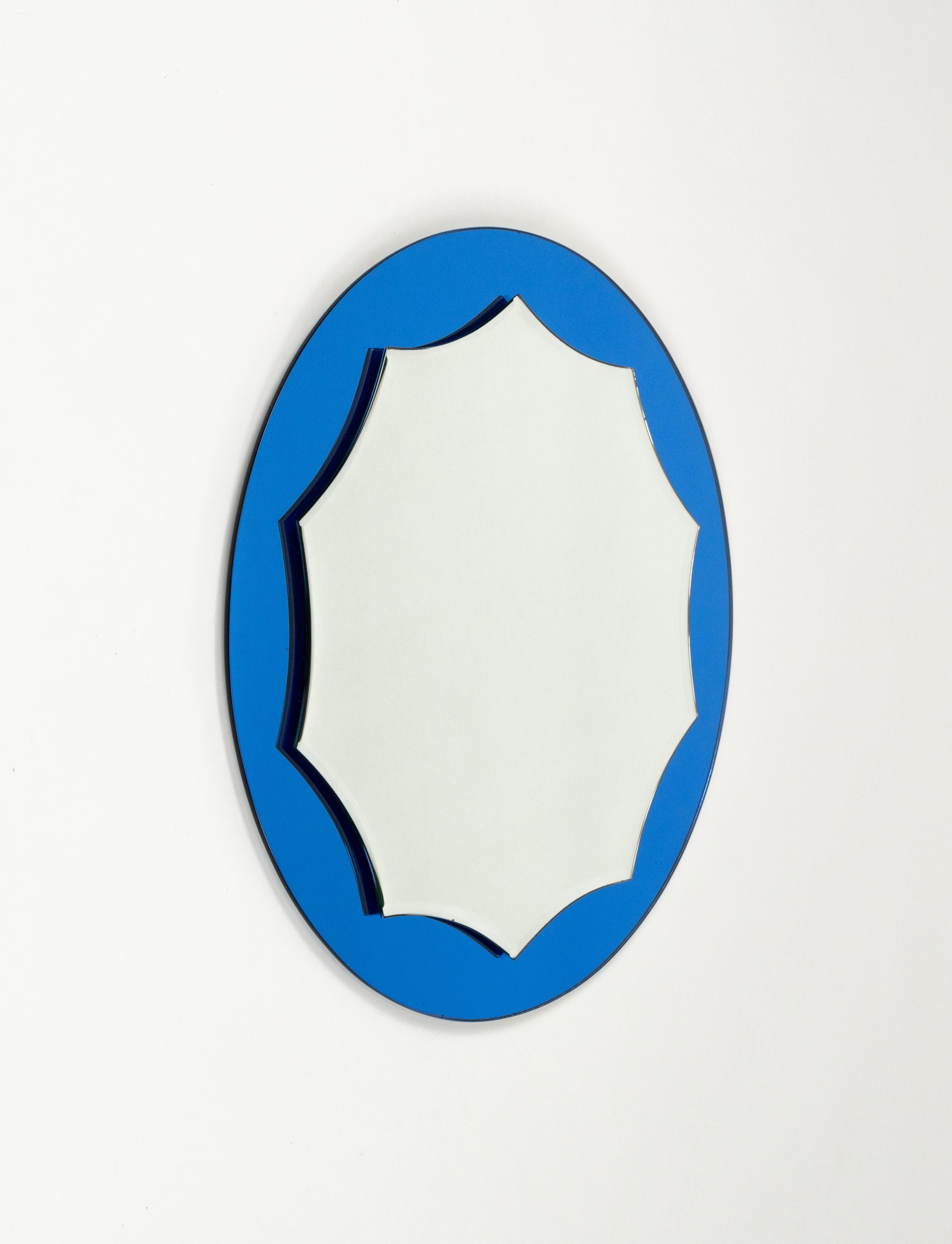 Midcentury amazing round blue wall mirror in the style of Cristal Arte or Fontana Arte.

Made in Italy in 1960s.

The mirror would be perfect for a bedroom, dressing room, cloakroom or hallway.

The mirror is very well-made, heavy and in very good